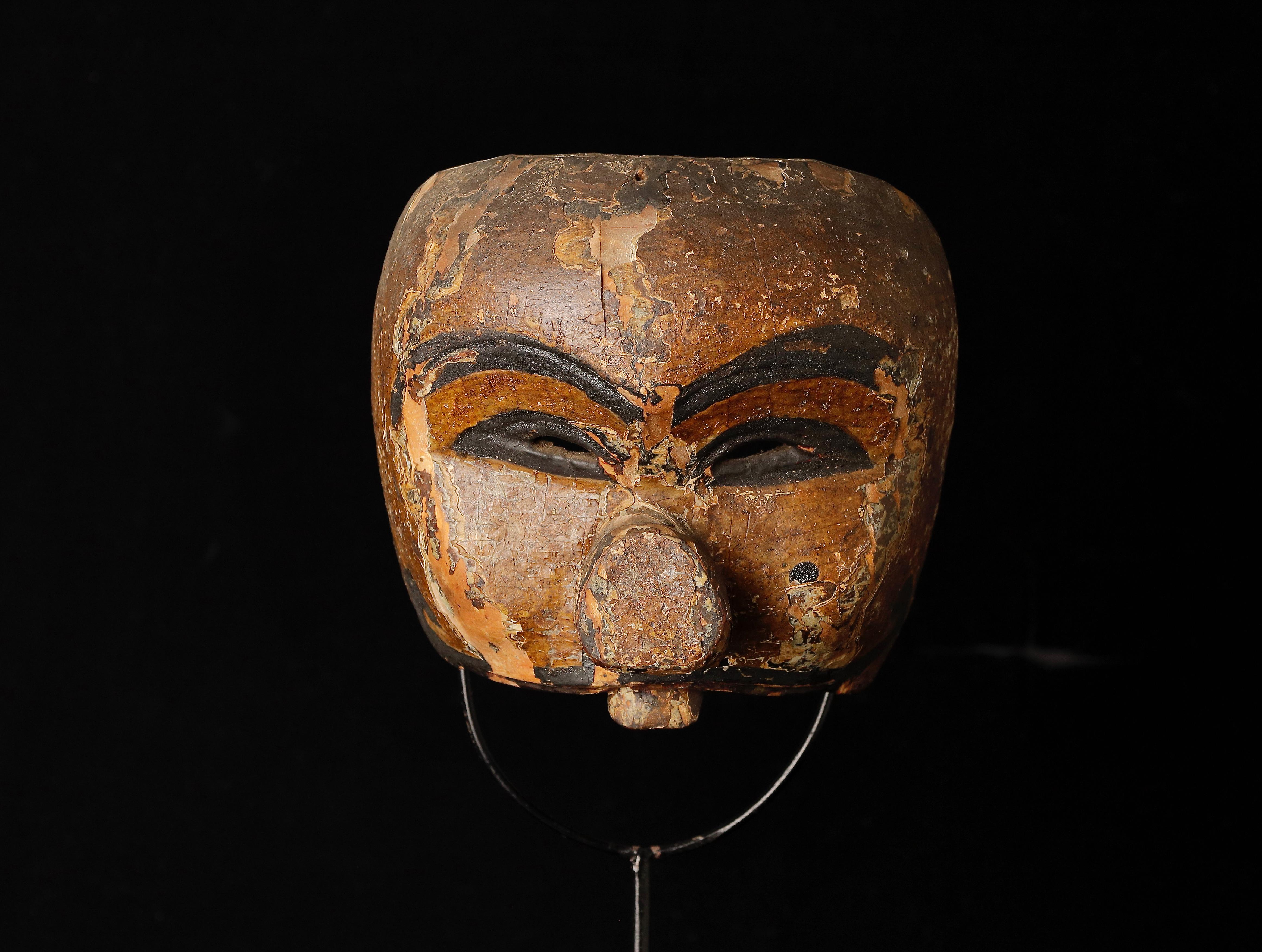 Indonesian ceremonial mask.
Age: 19th century 
Size: 15 x11x 14.5cm ( 6 x 4.3 x 5.7inch ) 
Weight: 314g ( 0.7lb ) 
Material: wood with paint
Good condition, some abrasions as you see in photo?