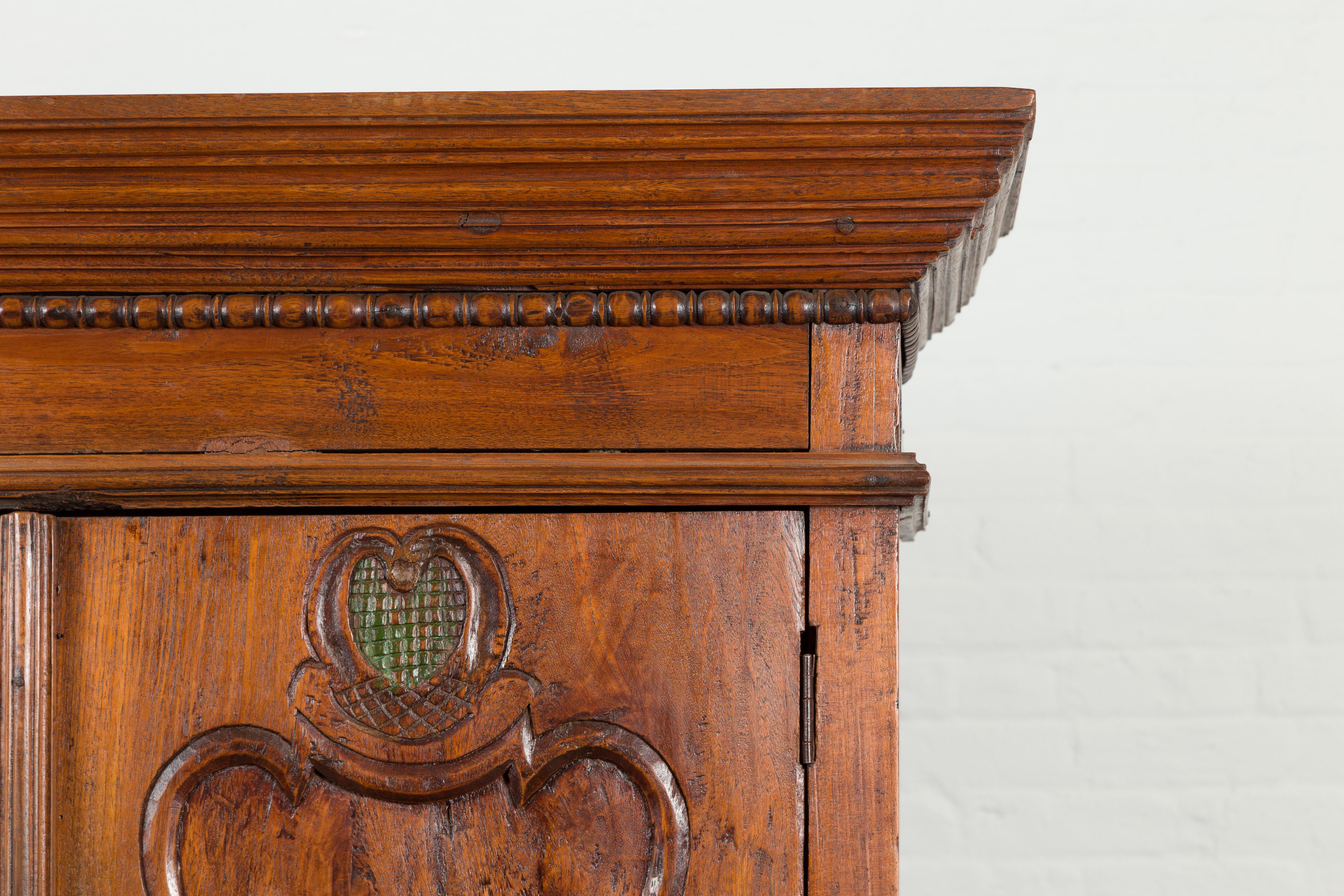 Indonesian Early 20th Century Carved Teak Wood Cabinet with Molded Cartouches For Sale 7