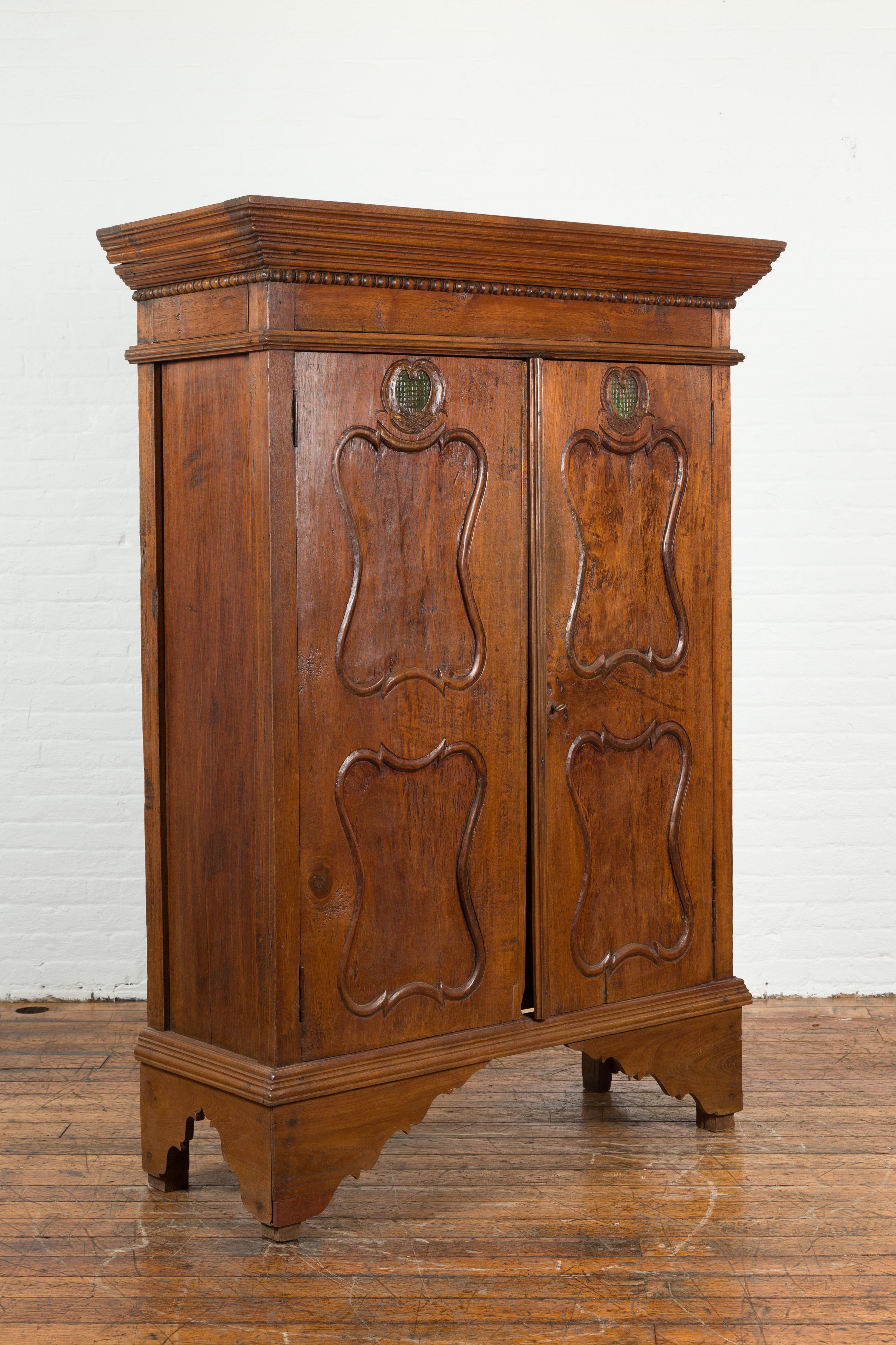 Indonesian Early 20th Century Carved Teak Wood Cabinet with Molded Cartouches In Good Condition For Sale In Yonkers, NY
