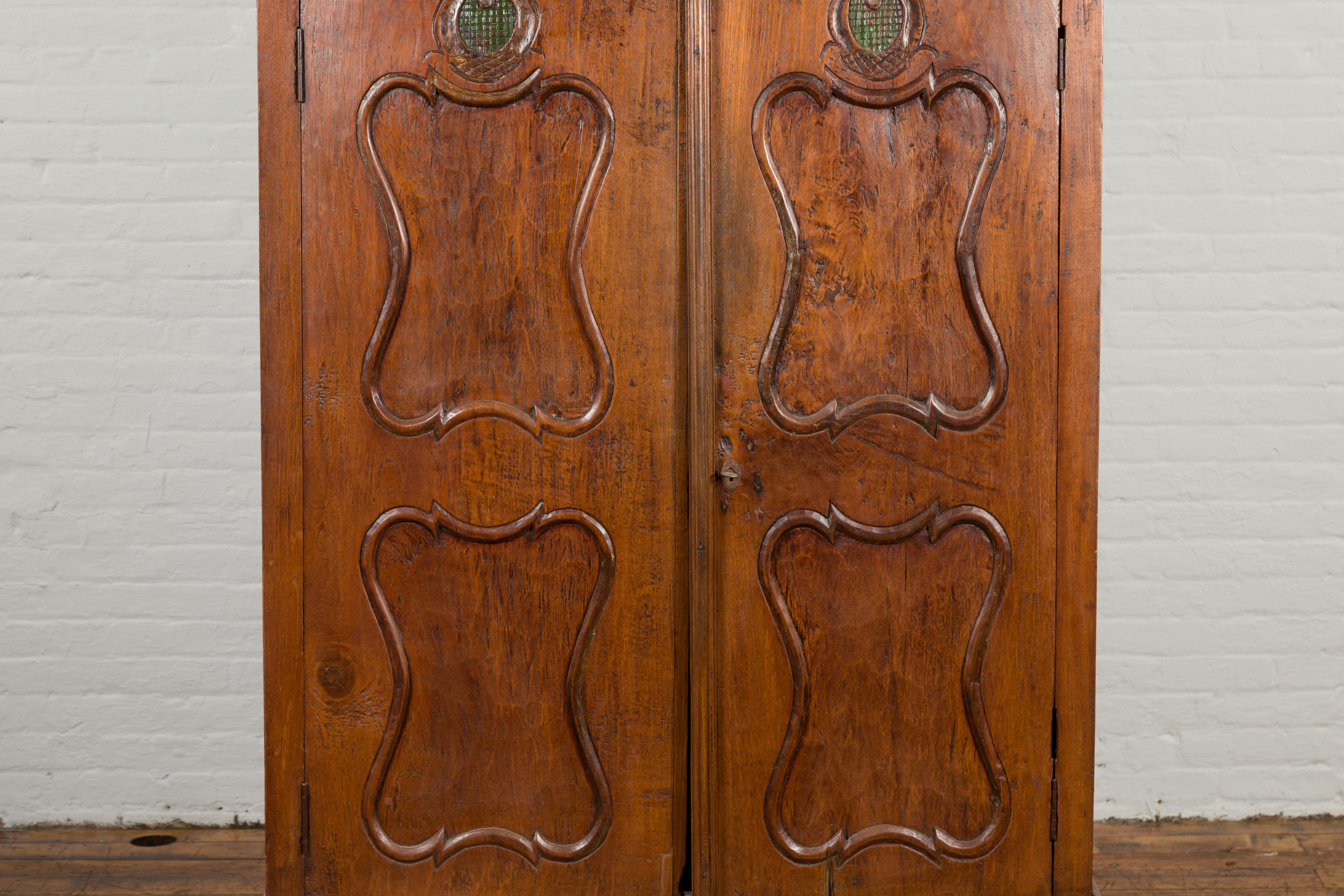 Indonesian Early 20th Century Carved Teak Wood Cabinet with Molded Cartouches For Sale 3