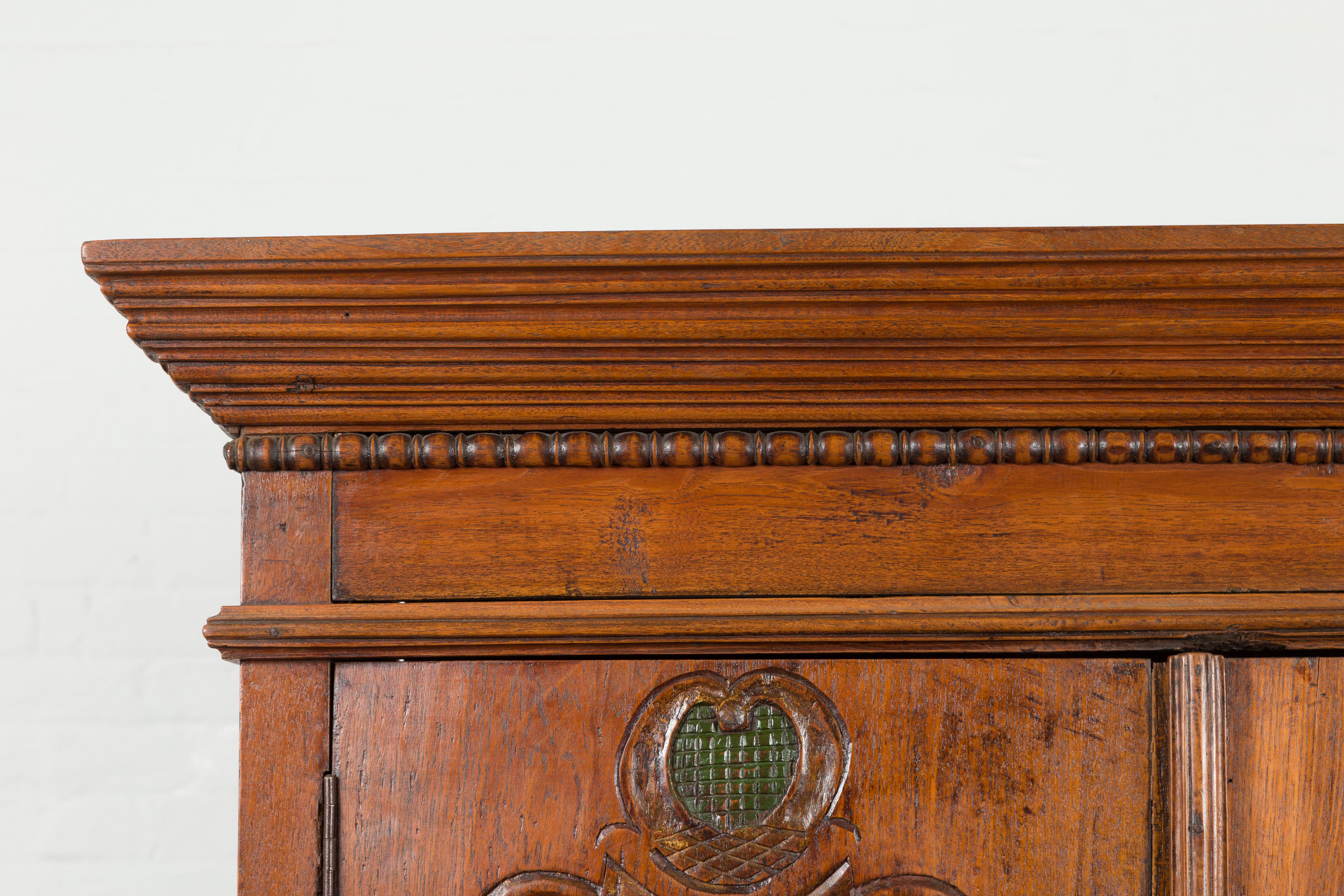 Indonesian Early 20th Century Carved Teak Wood Cabinet with Molded Cartouches For Sale 5