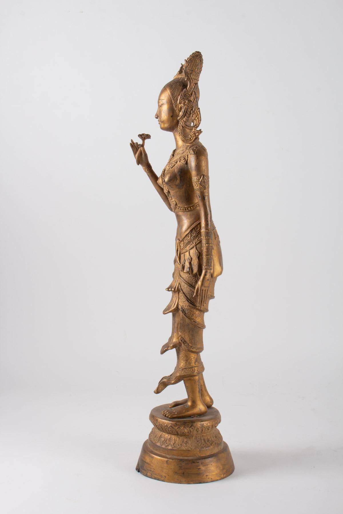 Indonesian Goddess in Gilded Metal Holding a Lotus Flower, 1920-1940 In Good Condition For Sale In Saint-Ouen, FR