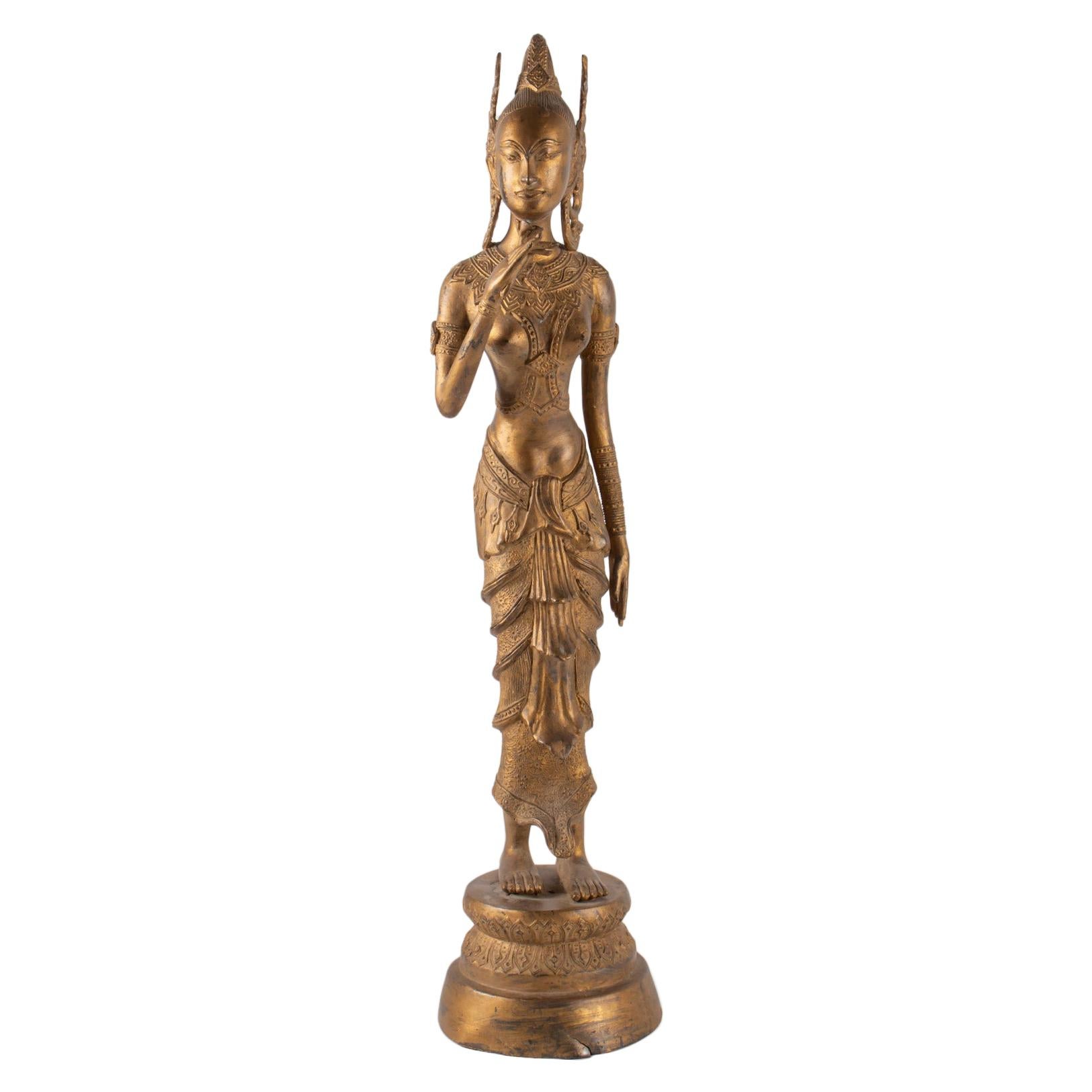 Indonesian Goddess in Gilded Metal Holding a Lotus Flower, 1920-1940 For Sale