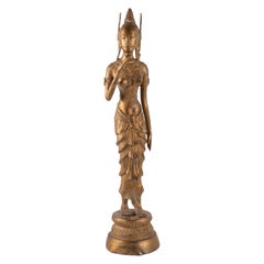 Indonesian Goddess in Gilded Metal Holding a Lotus Flower, 1920-1940