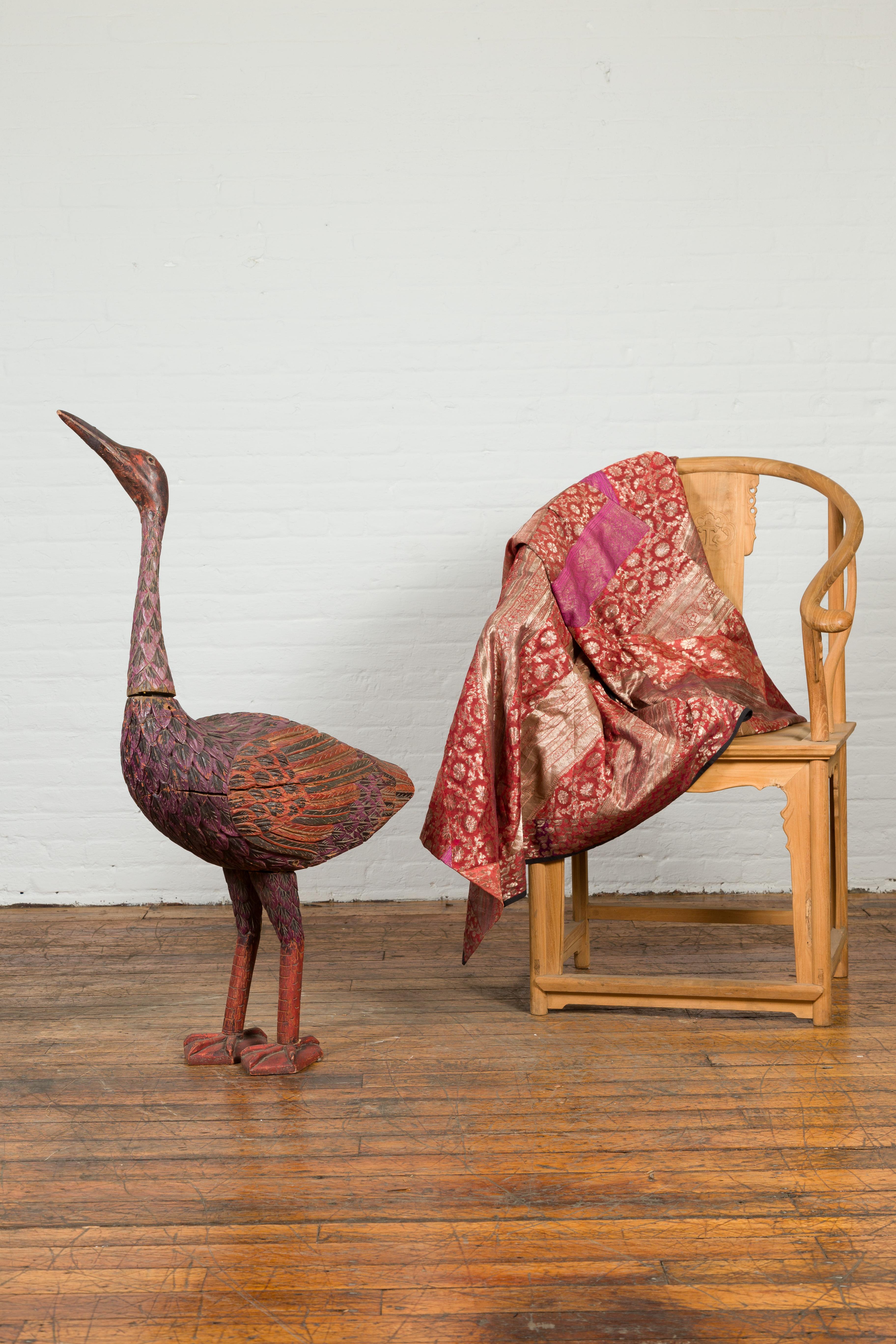 Hand-Carved Indonesian Hand Carved Heron Sculpture with Purple, Orange and Black Tones For Sale