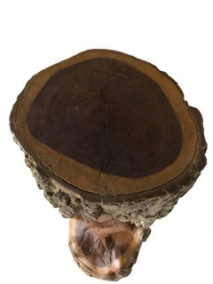 Hand-carved wooden statue with Lord Krishna from a piece of a tree