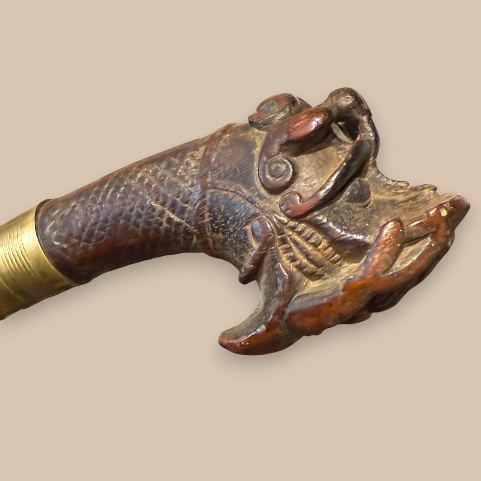 Indonesian Nias Sword with Carved Wooden Hilt and Brass-Bound Scabbard in vendita 2