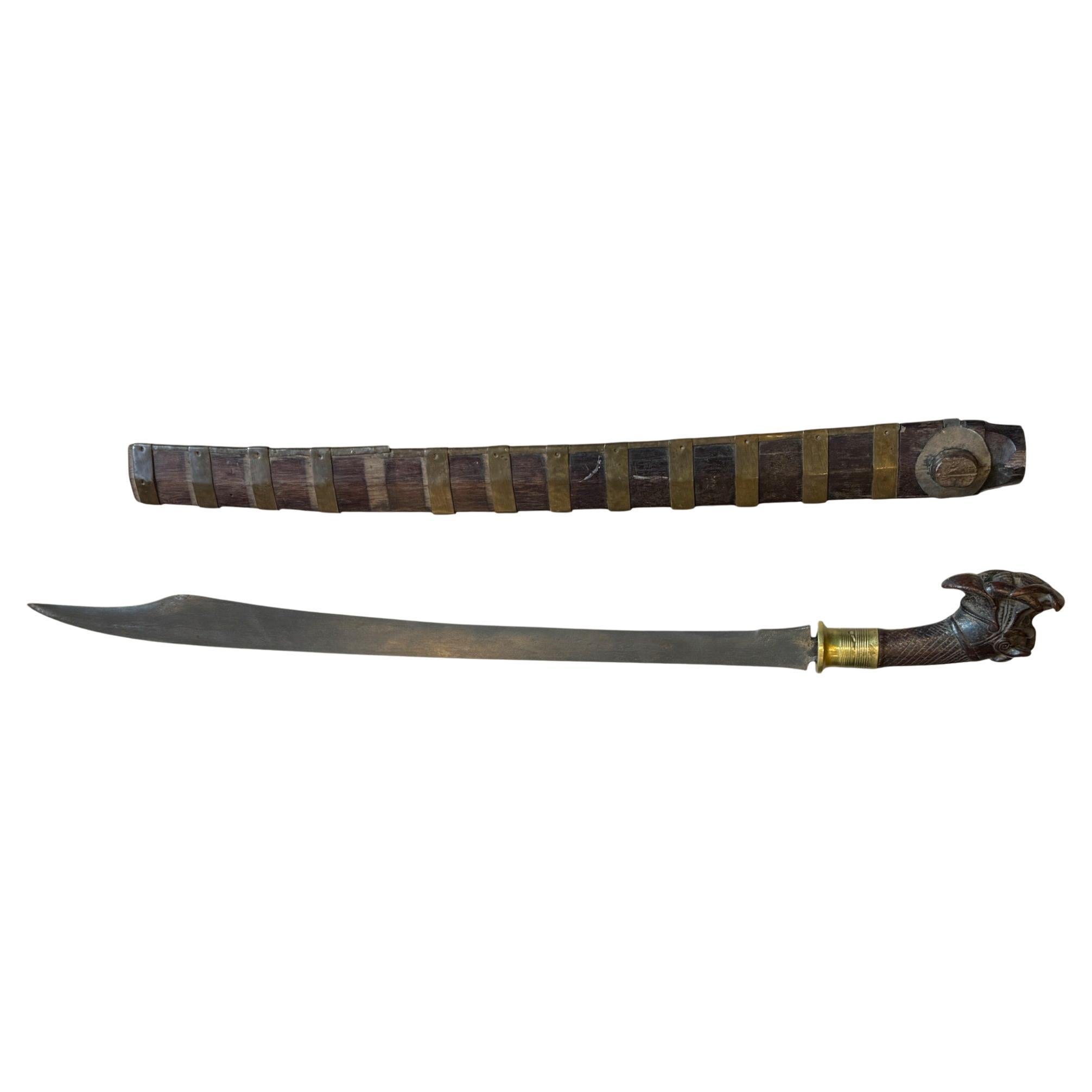 Indonesian Nias Sword with Carved Wooden Hilt and Brass-Bound Scabbard