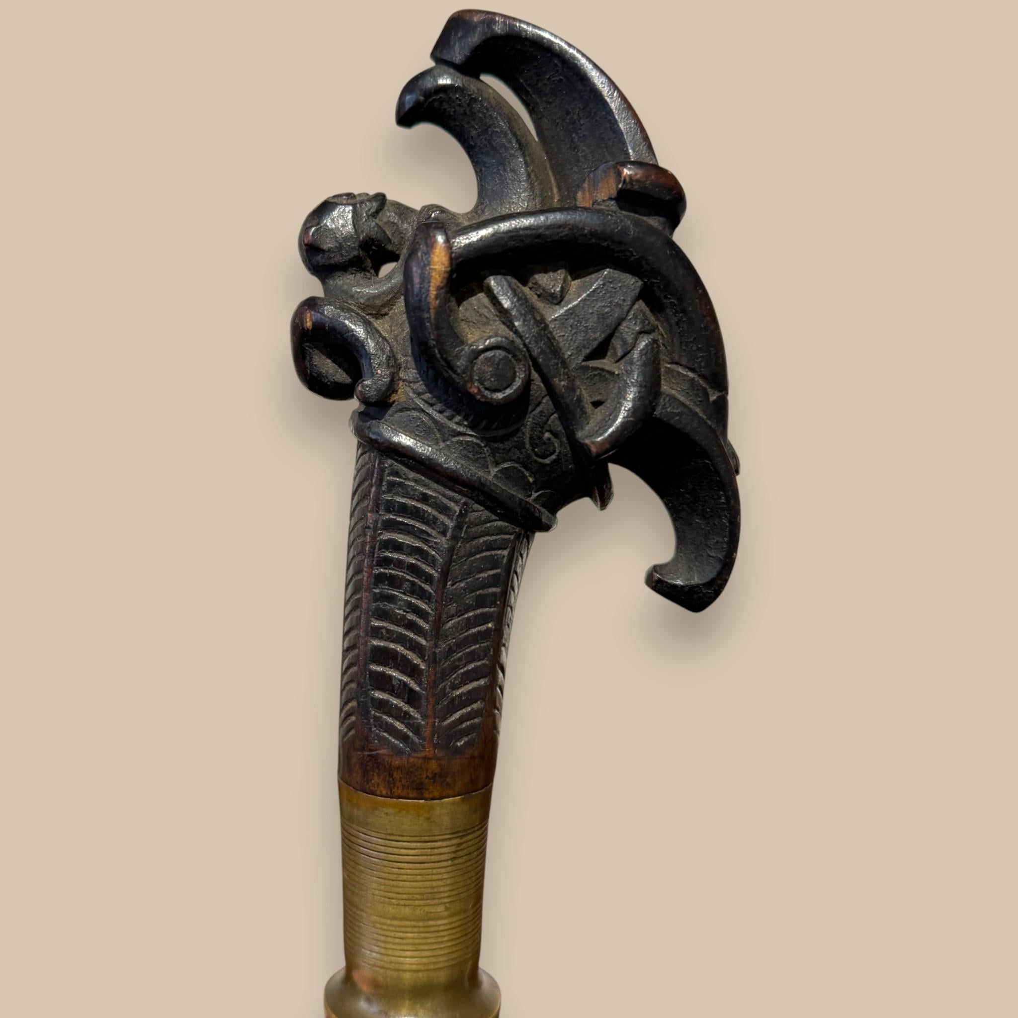XIX secolo Indonesian Single-Edged Sword with Carved Wooden Hilt, 19th Century in vendita