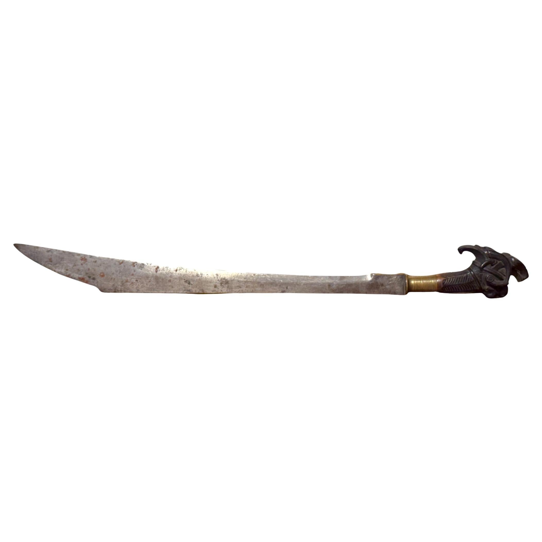 Indonesian Single-Edged Sword with Carved Wooden Hilt, 19th Century