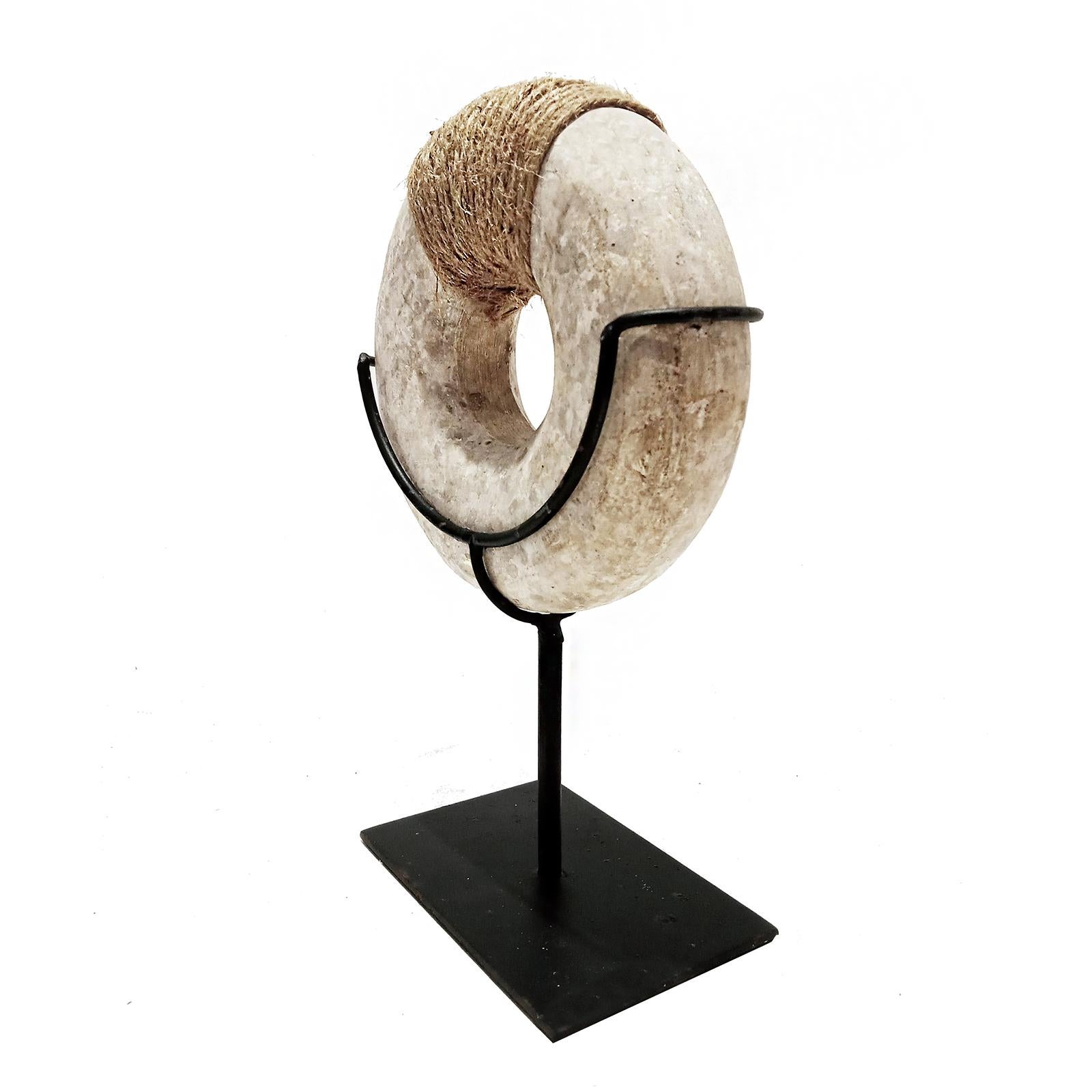 Hand-Carved Indonesian Stone Bracelet on Stand For Sale