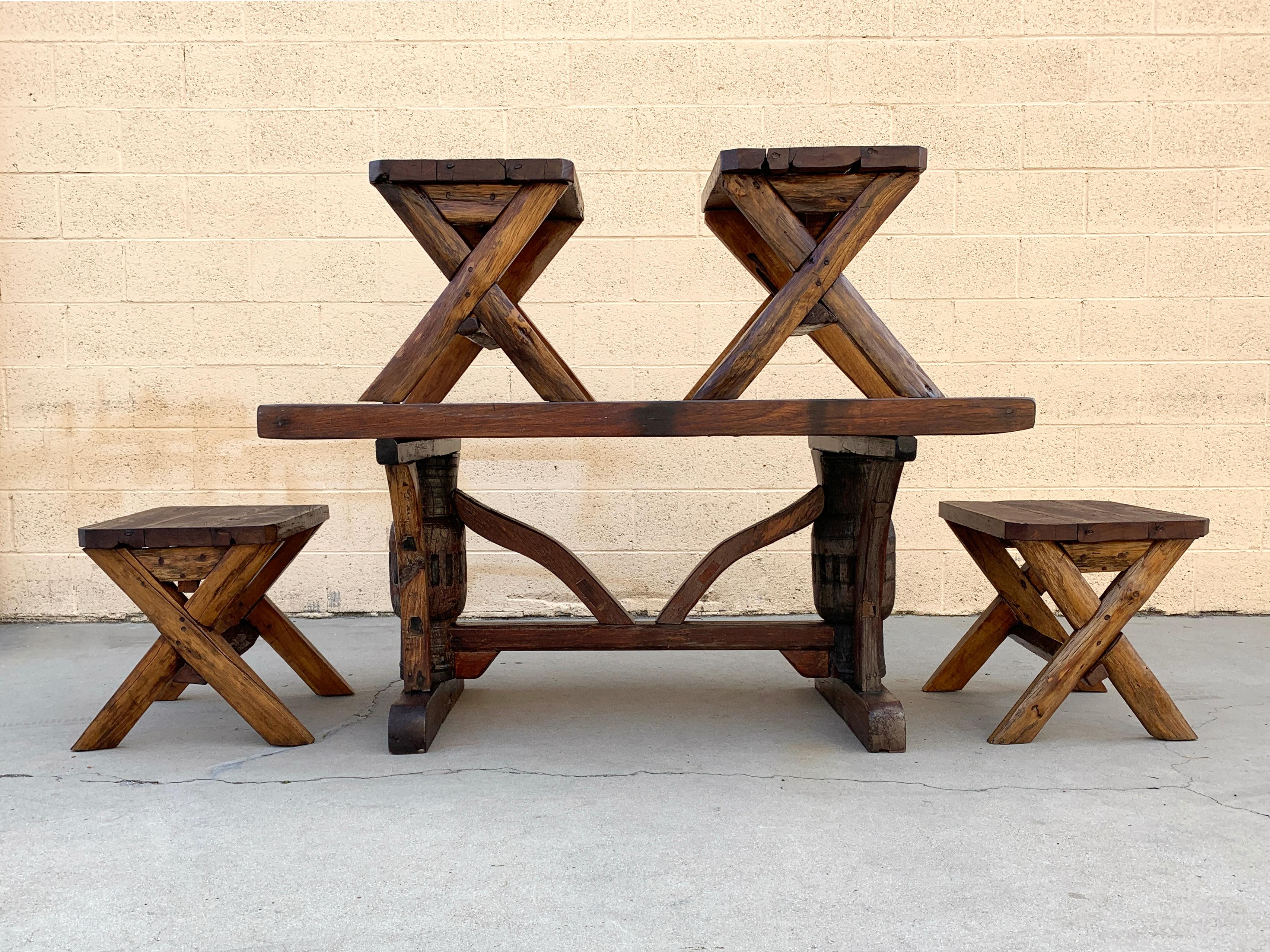 Indonesian teak dining table and bench set, beautifully handcrafted from thick timbers. Ornate design with rustic/ organic Southeast Asian flare. Top is 2