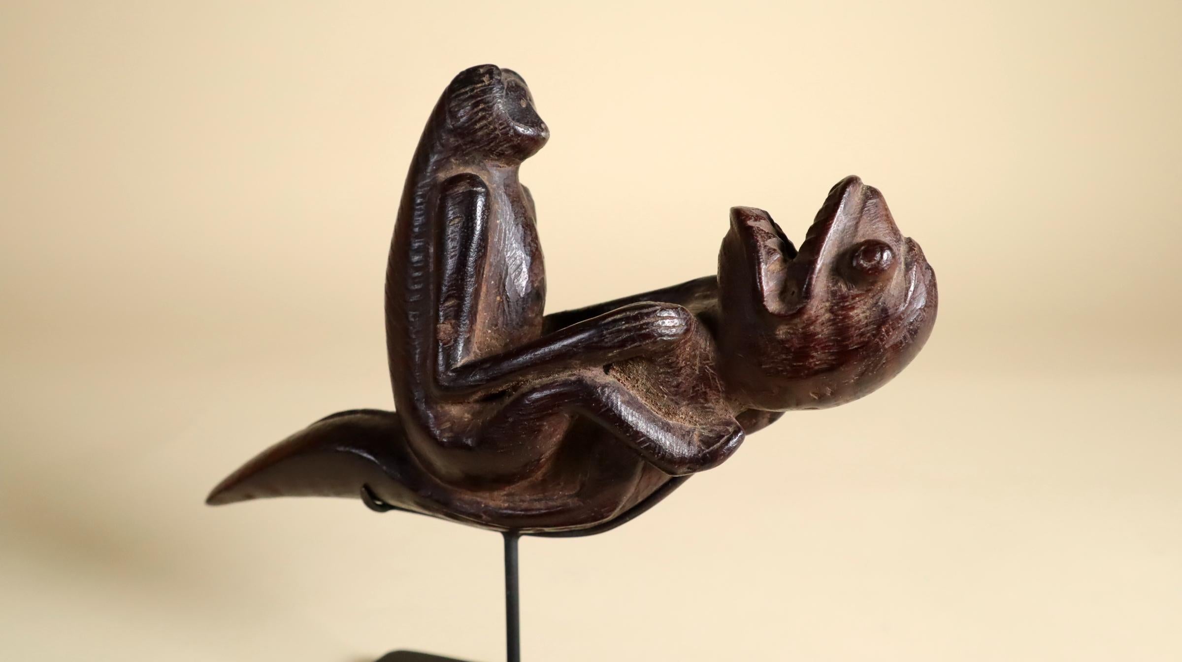 Hardwood Indonesian art Tribal Ritual Pipe with Patina Monkey Riding a Sea Monster For Sale