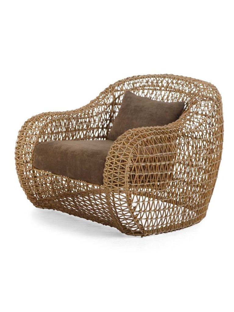 Balou easy armchair by Kenneth Cobonpue
Materials: Abacca, rattan, nylon. Steel.
Dimensions: 98.5 x 101.5 x H 75cm

Named after the bear from The Jungle Book, Balou exudes comfort at first glance with its light and breezy look. The collection's