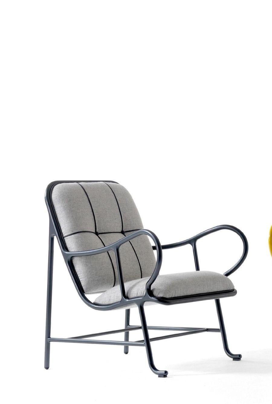 Indoor Gardenia armchair by Jaime Hayon 
Dimensions: D 89 x W 70 x H 100 cm 
Materials: structure in cast aluminum and laminates in extruded aluminum. Powder coating in Alesta Anodic Black or in high-gloss yellow (RAL 1005). Seat and backrest