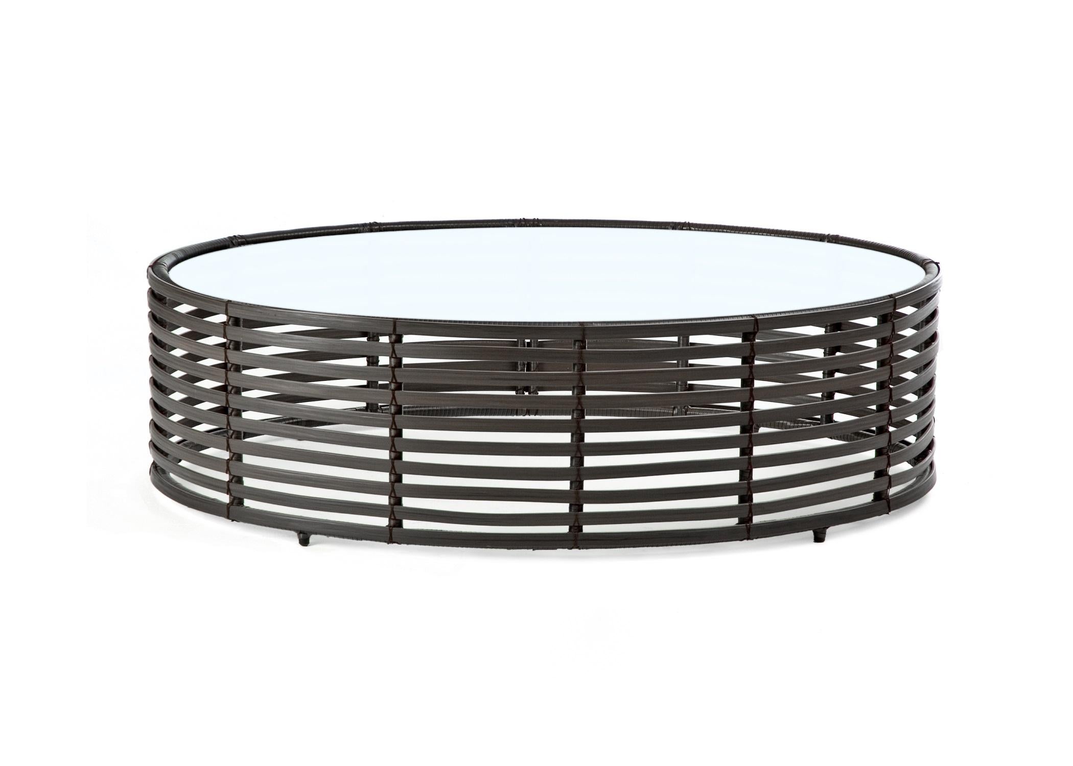 Indoor Large Oval Lolah coffee table by Kenneth Cobonpue
Materials: Nylon, steel, rattan. Glass.
Also available in other colors and for outdoors.
Dimensions: 
Glass 78cm x 118cm x H 10mm
Table 80cm x 120 cm x H 35 cm


Created using