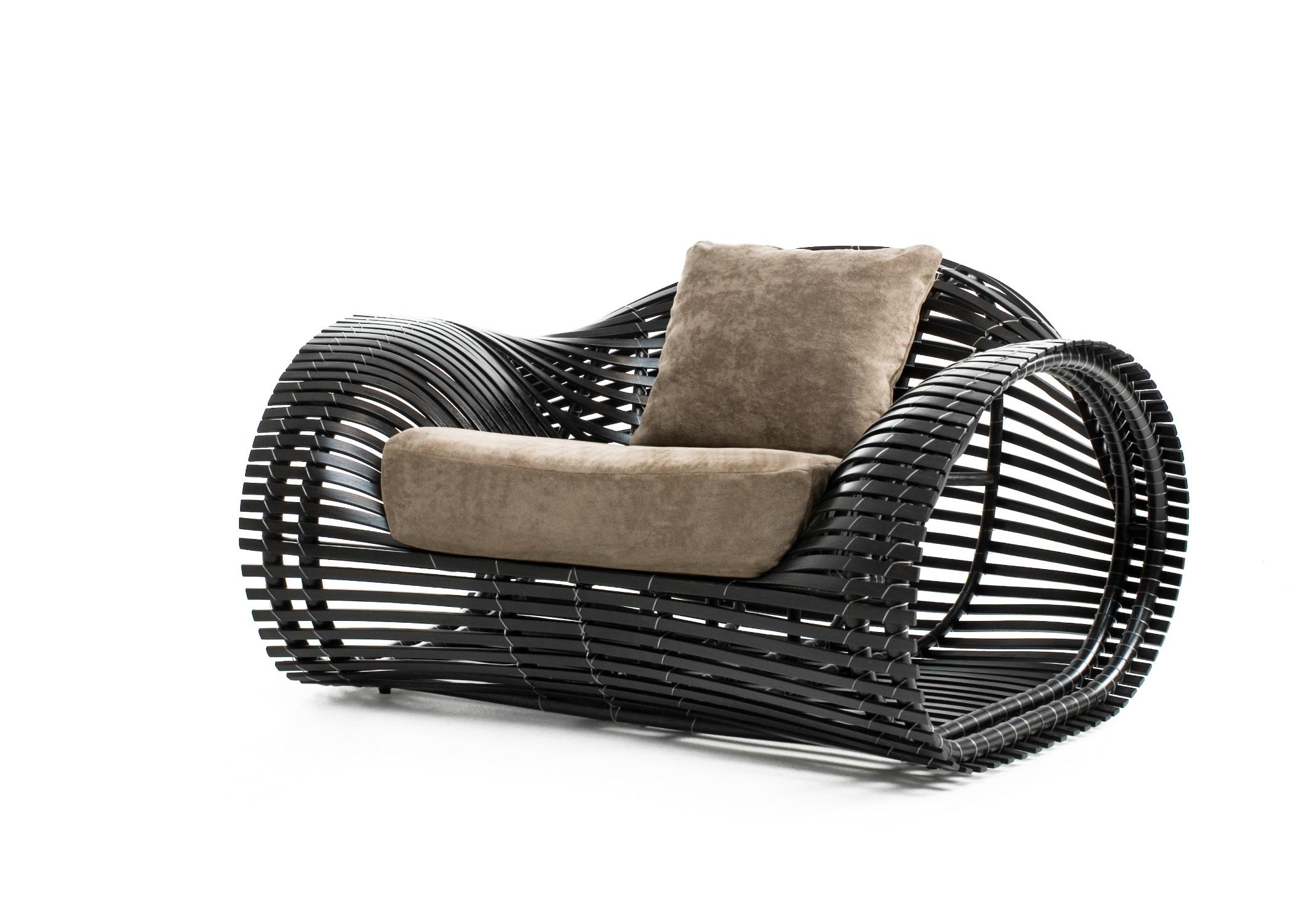 Indoor Lolah easy armchair by Kenneth Cobonpue
Materials: Rattan, nylon.
Also available in other colors and for outdoors. 
Dimensions: 103cm x 126cm x H 70cm

Created using construction techniques similar to boat-building, Lolah entices the