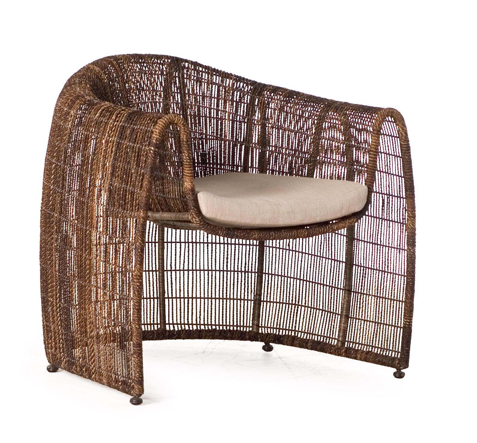 Indoor Lulu club chair by Kenneth Cobonpue
Materials: Abaca, nylon, steel. 
Also available in other colors and for outdoors. 
Dimensions: 78 cm x 84 cm x H 80.5 cm

Lulu adds grace to any space with its clean, nest-like silhouette. Its open