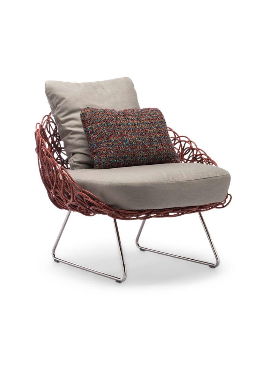 Indoor noodle armchair by Kenneth Cobonpue.
Materials: Rattan, nylon, stainless steel, steel. 
Also available in other colors and for outdoors.
Dimensions: 83.5 cm x 82 cm x H 72cm

Spontaneous and playful, Noodle celebrates serendipitous