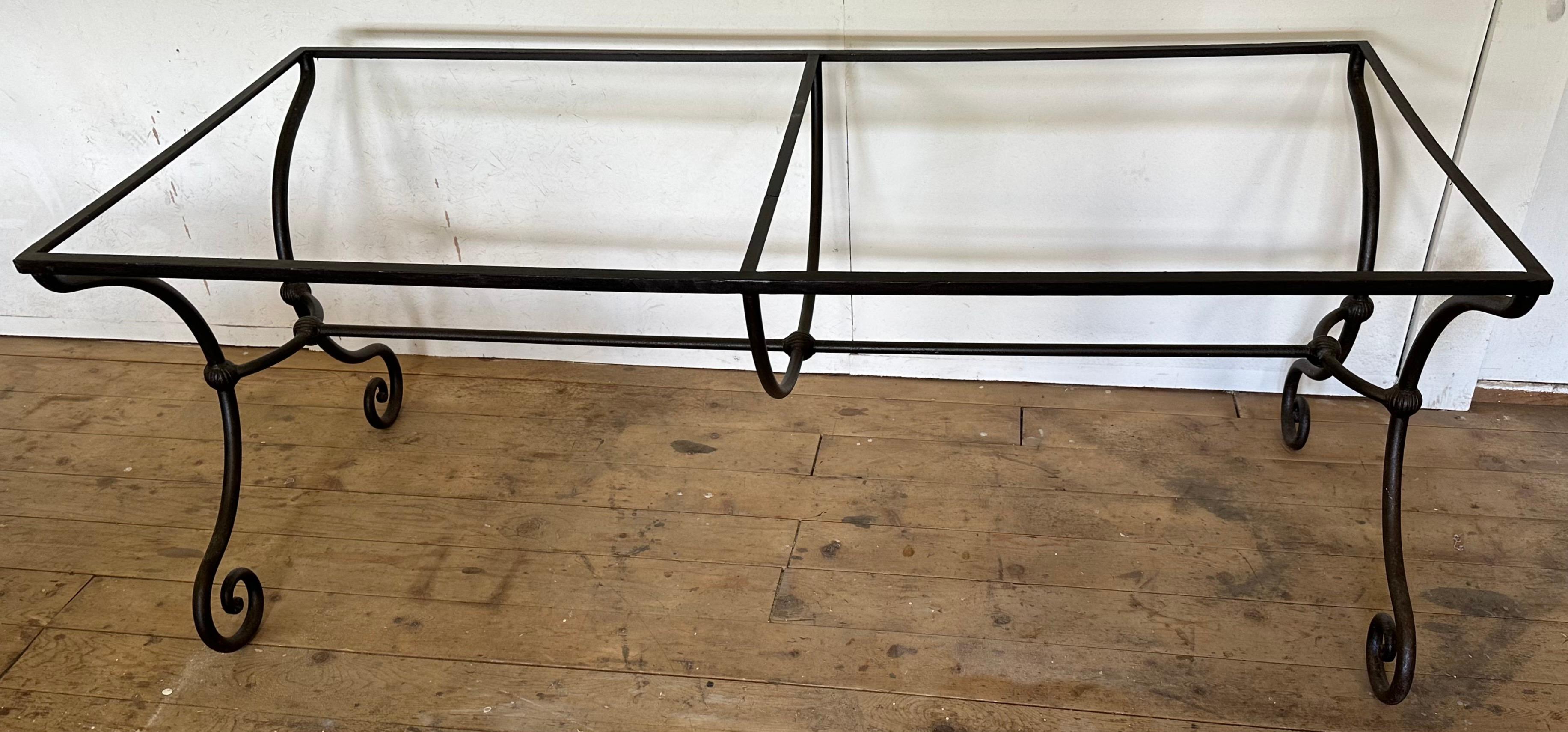 A striking and most decorative French mid-century wrought iron base with elegantly scrolled curved legs at either end, connected by a stretcher that will hold a top of your choice be it stone, wood or glass.
Depending on the size of table top, the