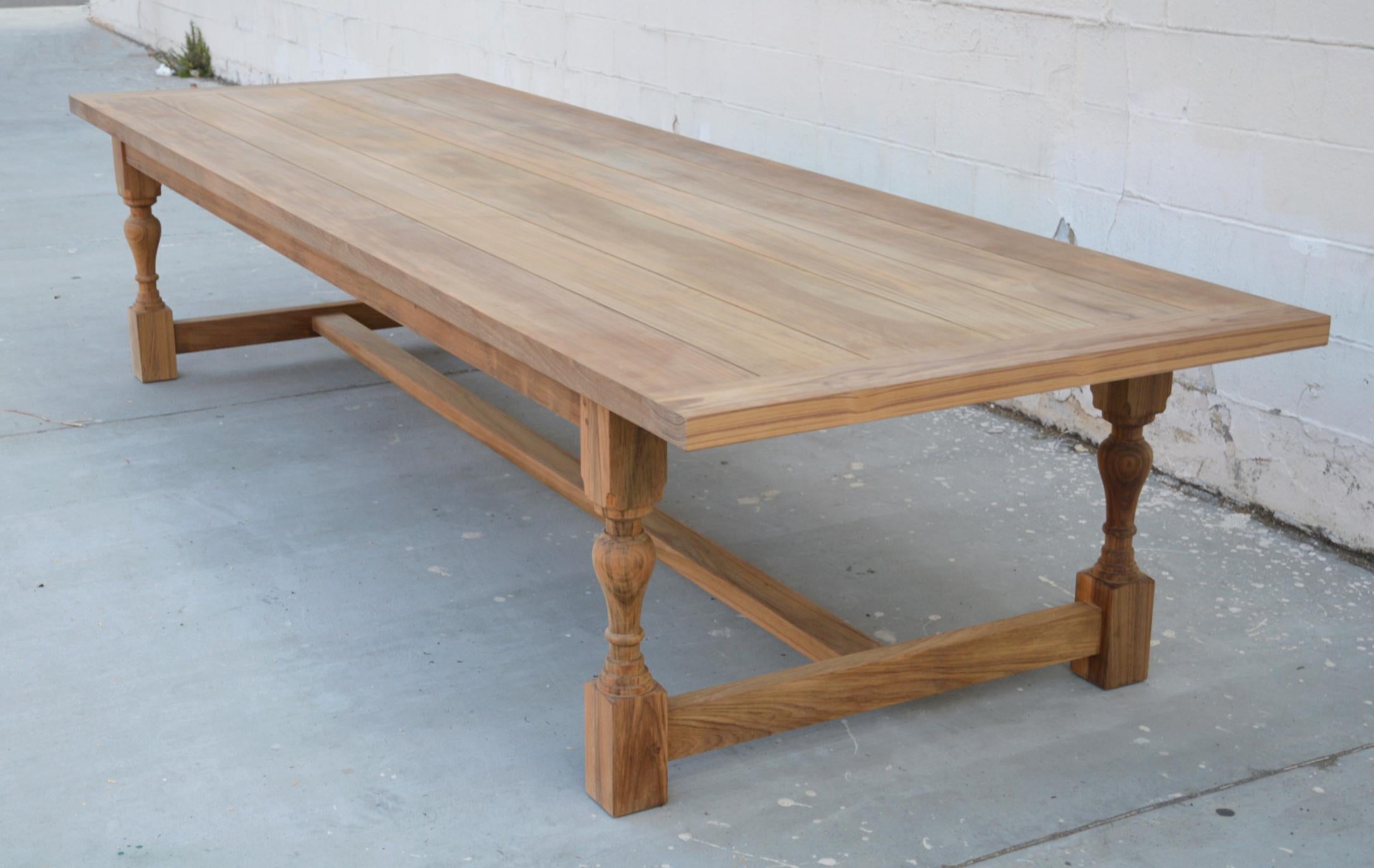 Designed to withstand any climate, this teak dining table can be used either indoors or outdoors. Seen here in 144