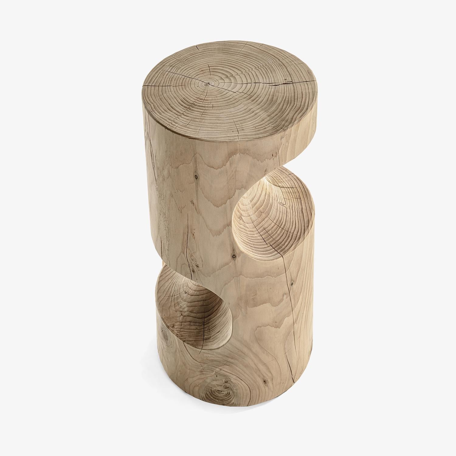 The Slalom high barstool, designed by Giovanni Tomasini for Riva 1920, is a striking piece of furniture that showcases the brand's dedication to craftsmanship and natural materials. This barstool is crafted from a single block of solid cedar wood,