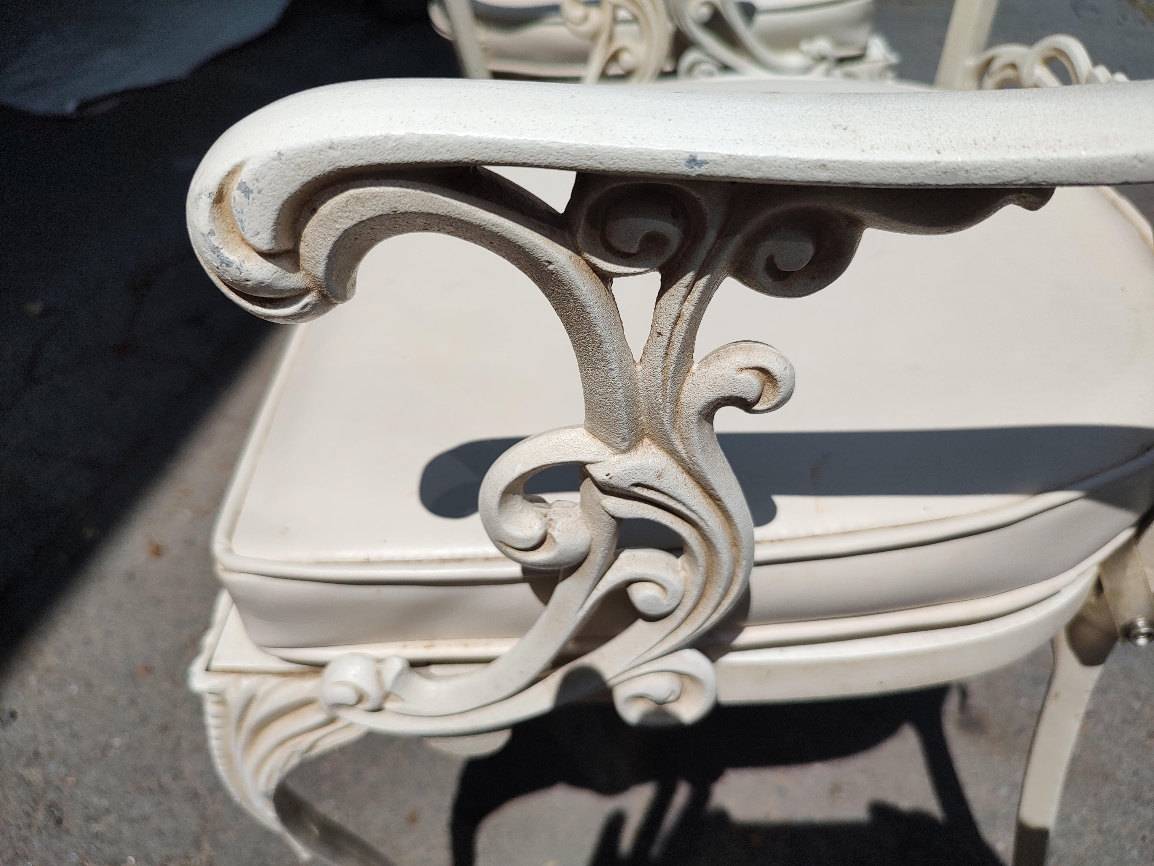 Classic fabulous indoor outdoor patio set in cast aluminum by Molla of Italy. Impeccable castings in aluminum and then powder coated. Ball and claw foot on front legs of the chairs where there is a double casting on the seat backs. All are armchairs