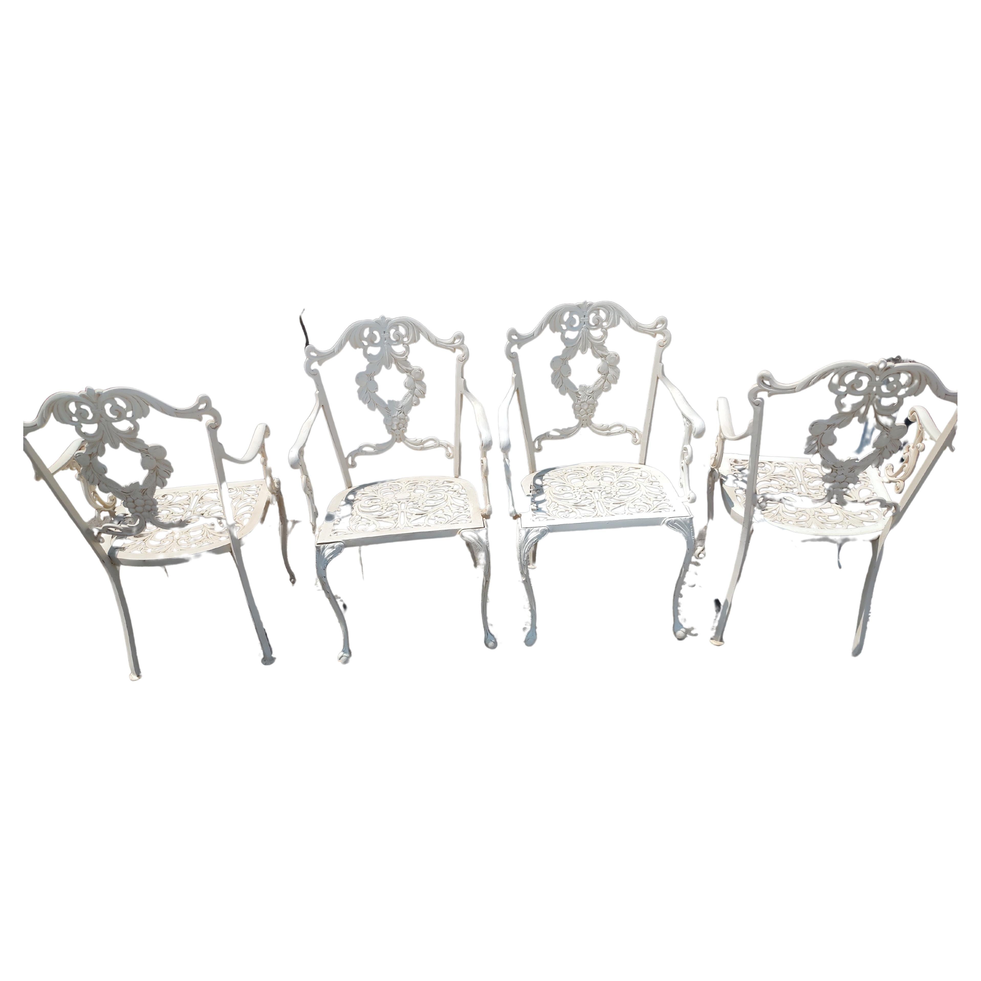 Classic fabulous indoor outdoor patio set in cast aluminum by Molla of Italy. Impeccable castings in aluminum and then powder coated. Ball and claw foot on front legs of the chairs where there is a double casting on the seat backs. All are armchairs