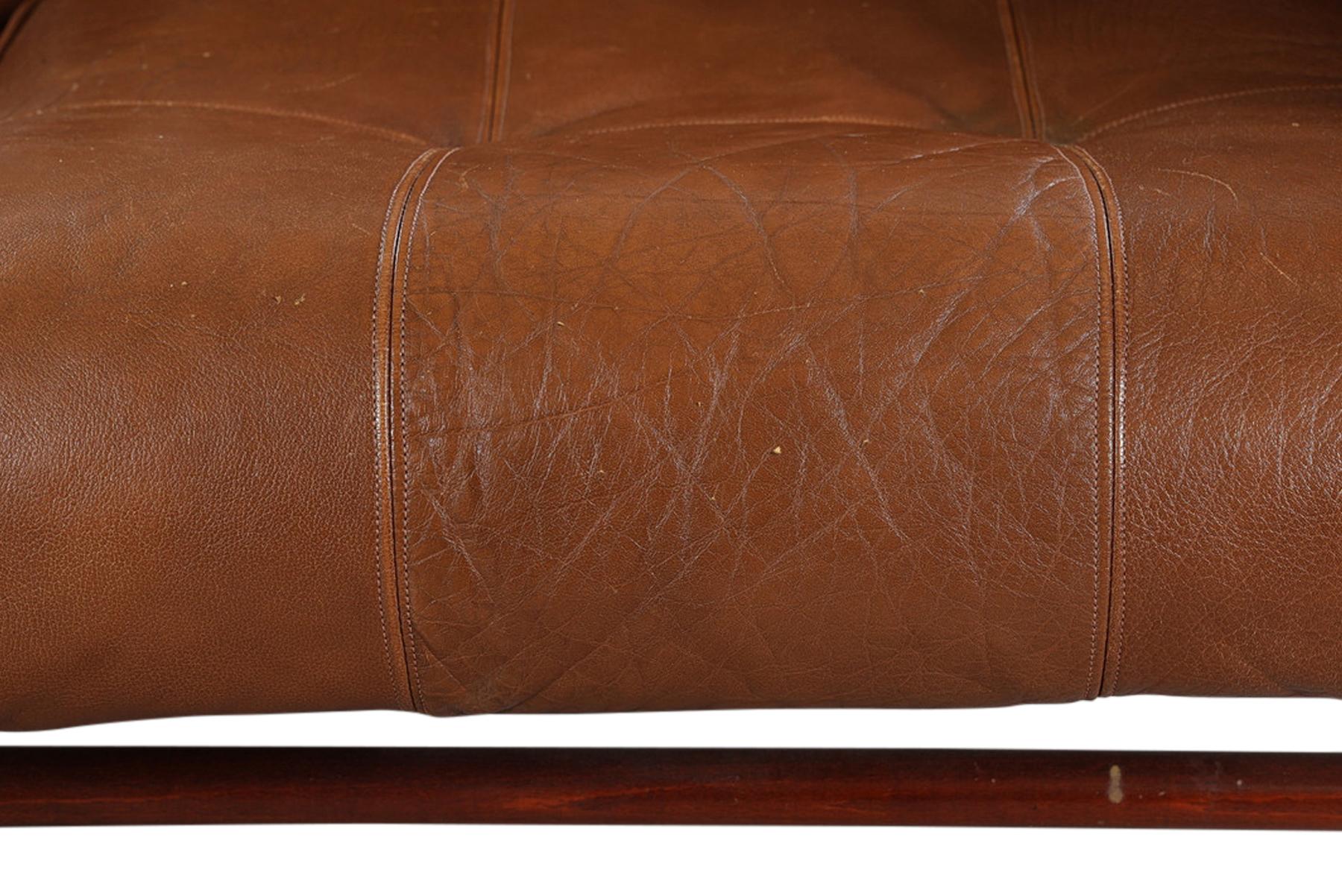 Origin: Sweden
Designer: Arne Norell
Manufacturer: Arne Norell Møbler
Era: 1960s
Materials: leather, beech
Measurements: 63.75? wide x 34