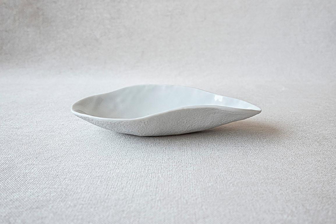 • small porcelain side dish
• measures 16cm x 8,5cm x 3cm
• perfect for a sexy amuse-bouche, a pre-dessert or side dish
• for that sexy dinner party
• white glazed top and unglazed textured bottom
• designed in Amsterdam / handmade in France
•