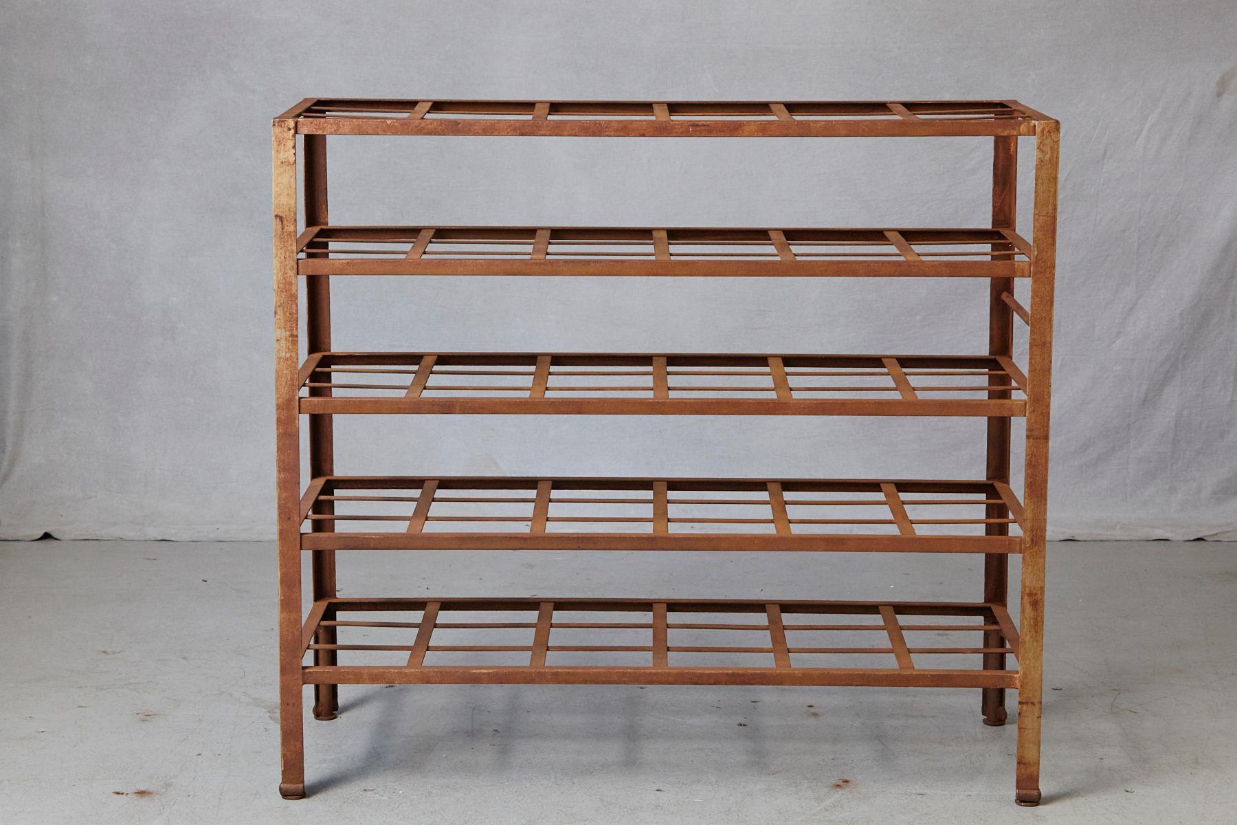 Stunning and rare, heavy and solid industrial 5 tier multi shelf with fixed grid shelves, nicely weathered, circa 1960s.
Great for usage as book shelf for large coffee table books or as planting shelf for seedlings.
