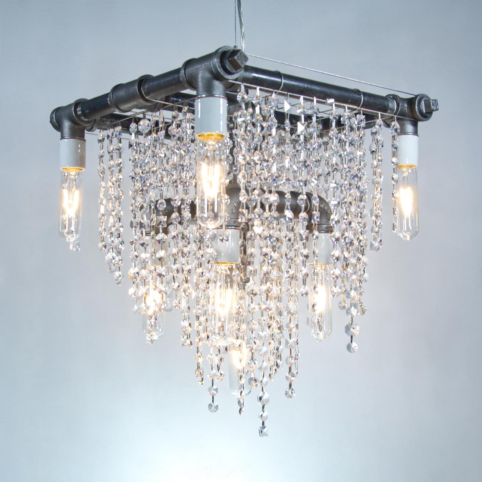 Industrial 9 bulb compact pendant chandelier by Michael McHale
Dimensions: D 35.5 x W 35.5 x H 40.5
Materials: steel, optically-pure gem-cut crystal.

9 x medium base T6 bulb, either incandescent or LED

All our lamps can be wired according to