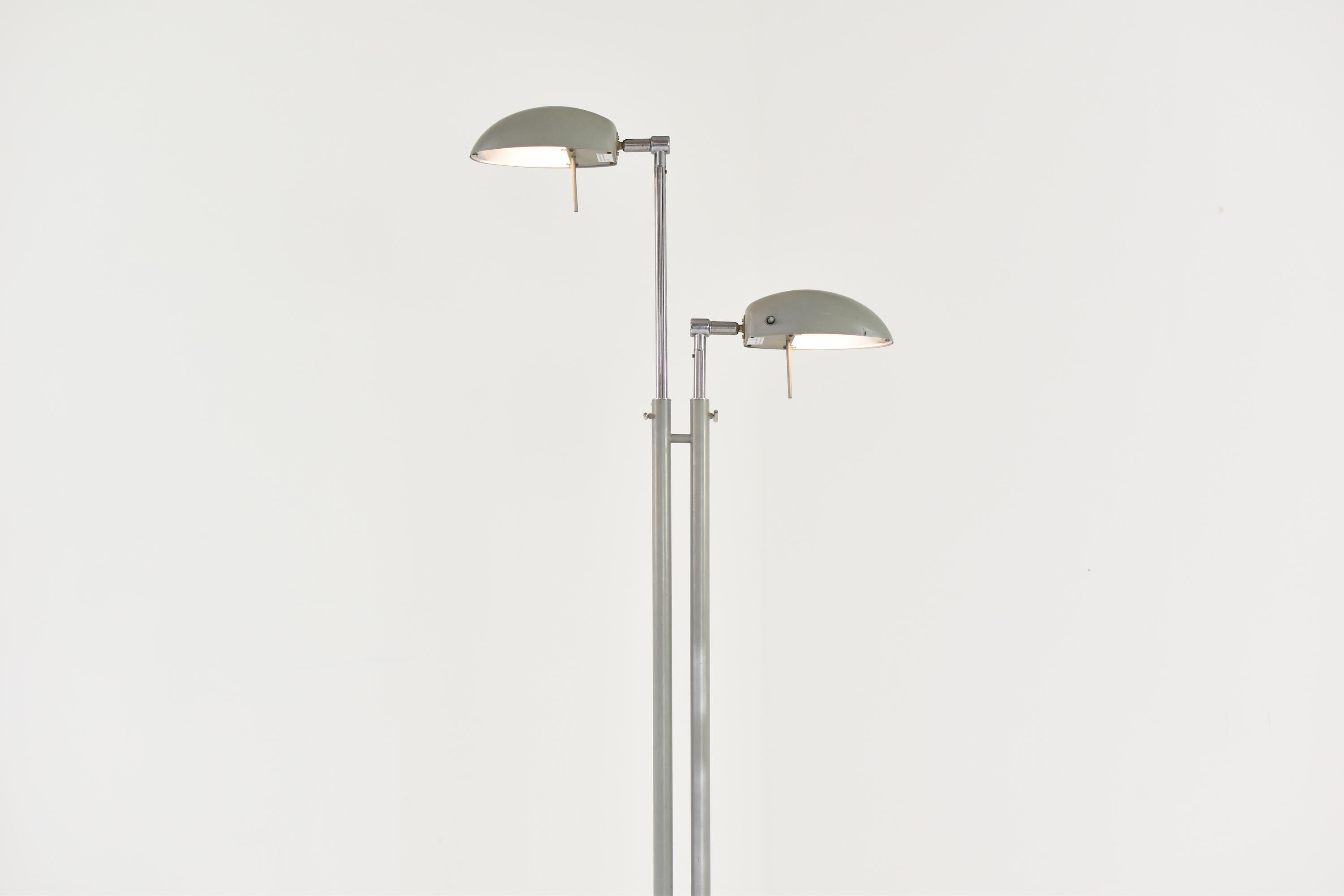 Industrial floor lamp from France, 1960s. This 2 shade floor lamp is adjustable in height and can be positioned in any angle preferred. It features the original mint green lacquer and is overall in a very good and original condition.