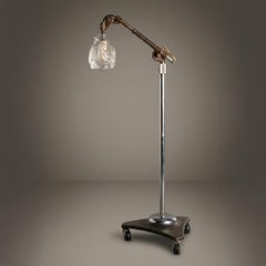 Industrial Adjustable Floor Lamp with Blown Glass Shade by Jason Wein