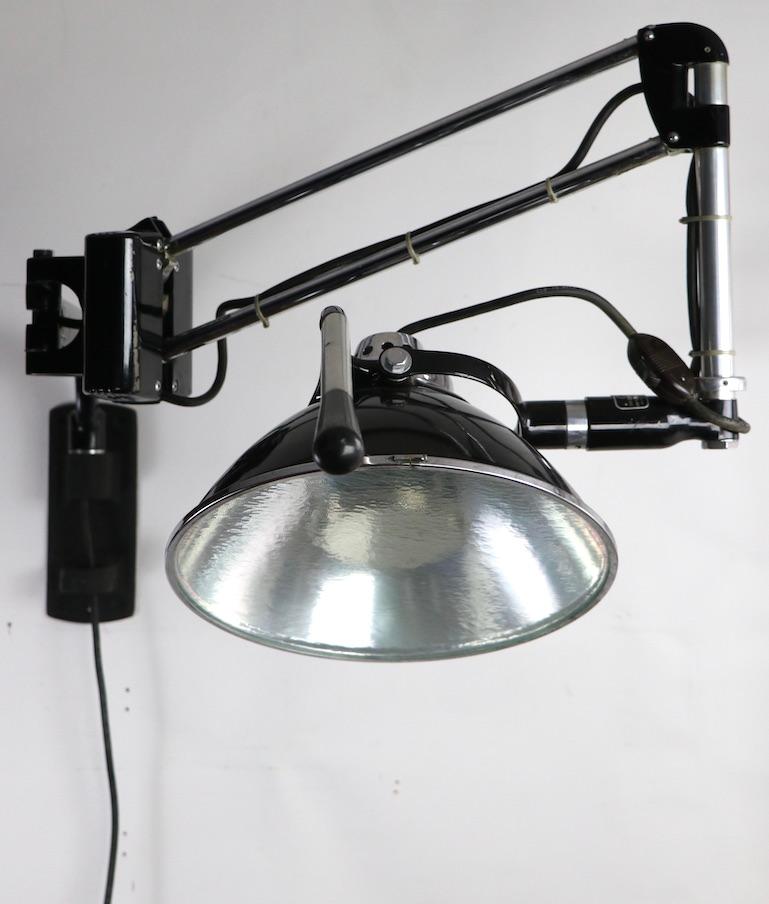 20th Century Industrial Adjustable Wall Mount Dental Light by the Wilmont Castle Co.