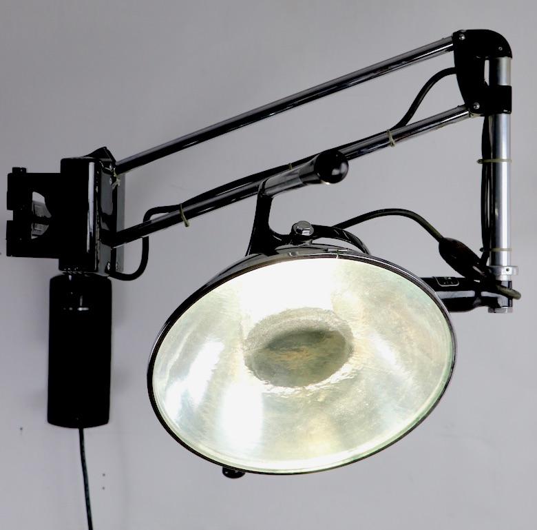 Metal Industrial Adjustable Wall Mount Dental Light by the Wilmont Castle Co.