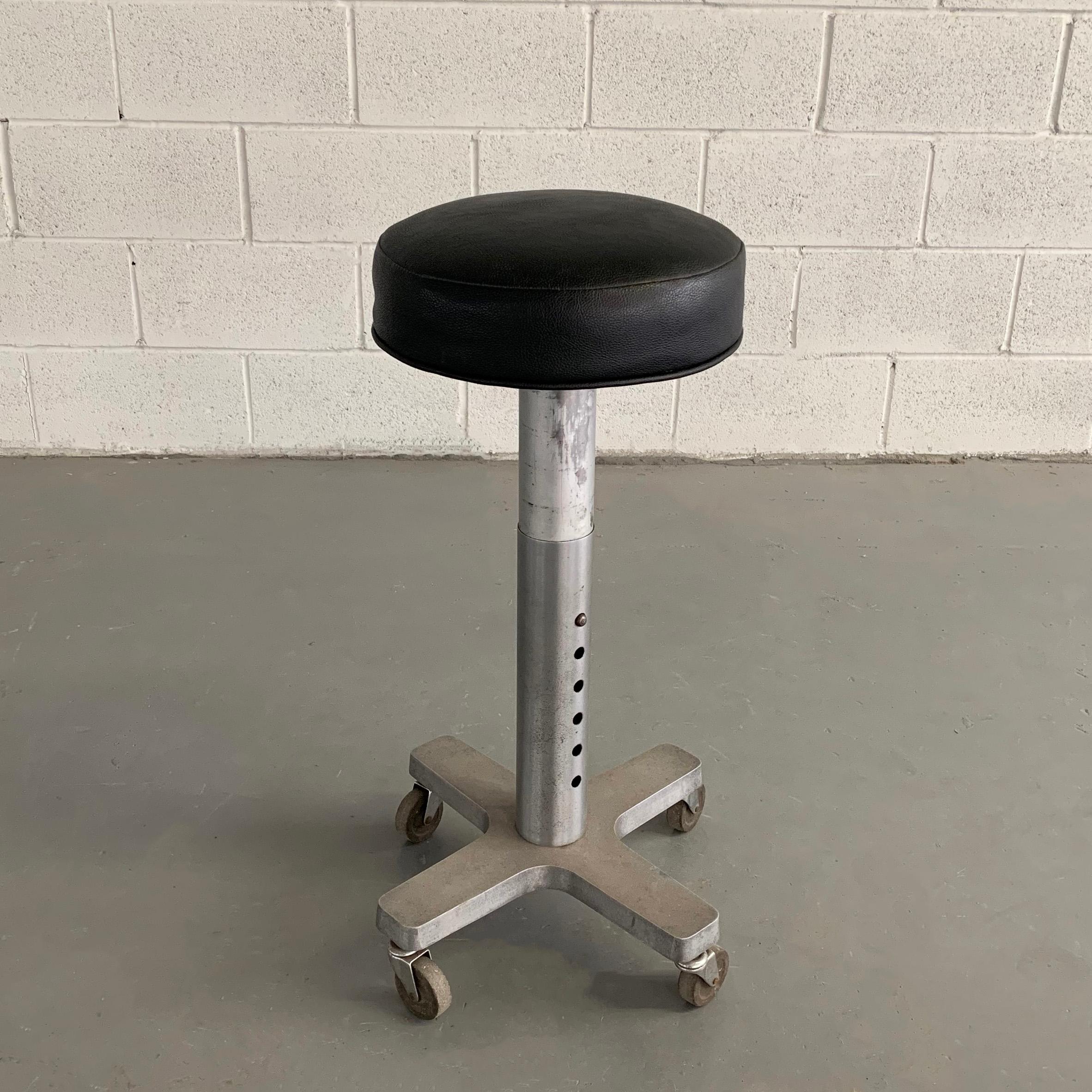 Industrial, midcentury, medical, dentist stool with newly upholstered, 12 inch diameter, leather seat is height adjustable from 22 - 30 inches.