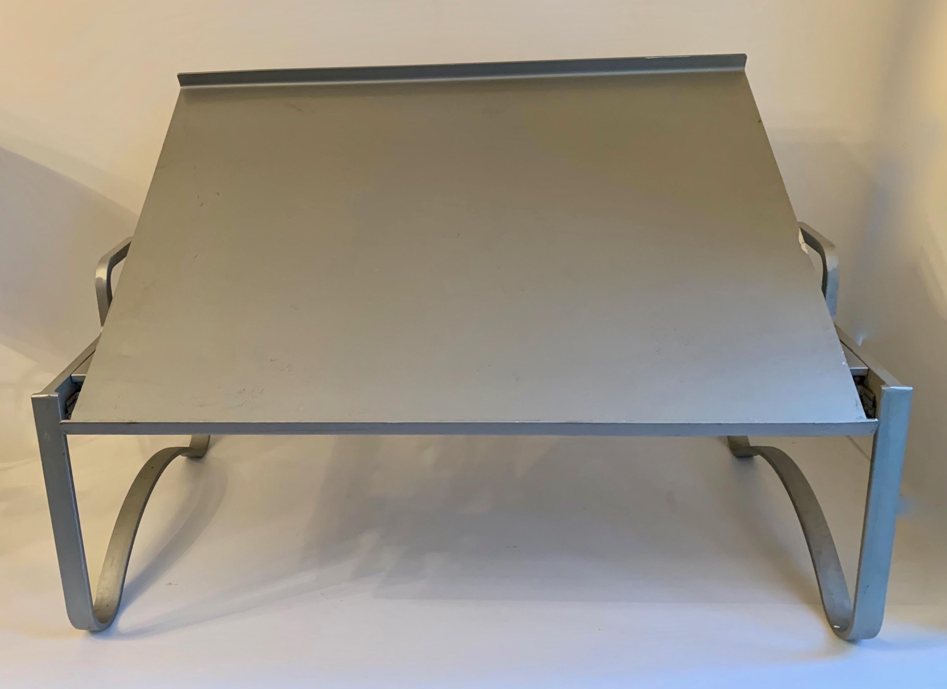 Industrial aluminum bed tray - collapsable and adjustable to four positions. Works perfectly as a bed tray or work station, lectern or book stand. Folds to a very flat piece for easy storage.

Collapsed: 16 depth x 26.75 width x 2.5 thick.