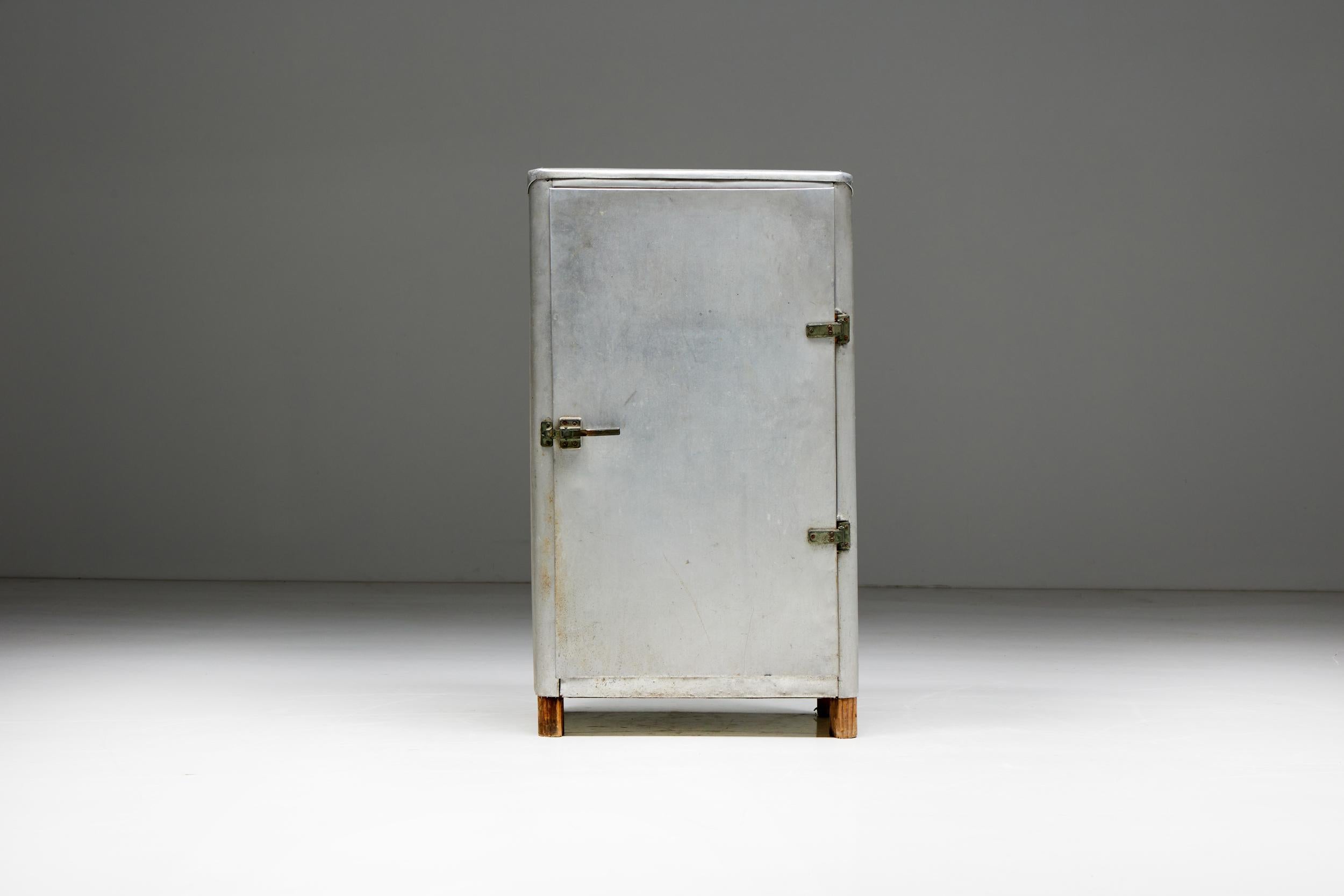 French Design; Industrial Design; 1950s; France; Aluminum; Brutalist; Mid-Century; Craftsmanship;

French aluminum cabinet that once served as a refrigerator, a timeless relic from the 1950s that captures the essence of industrial design. Crafted