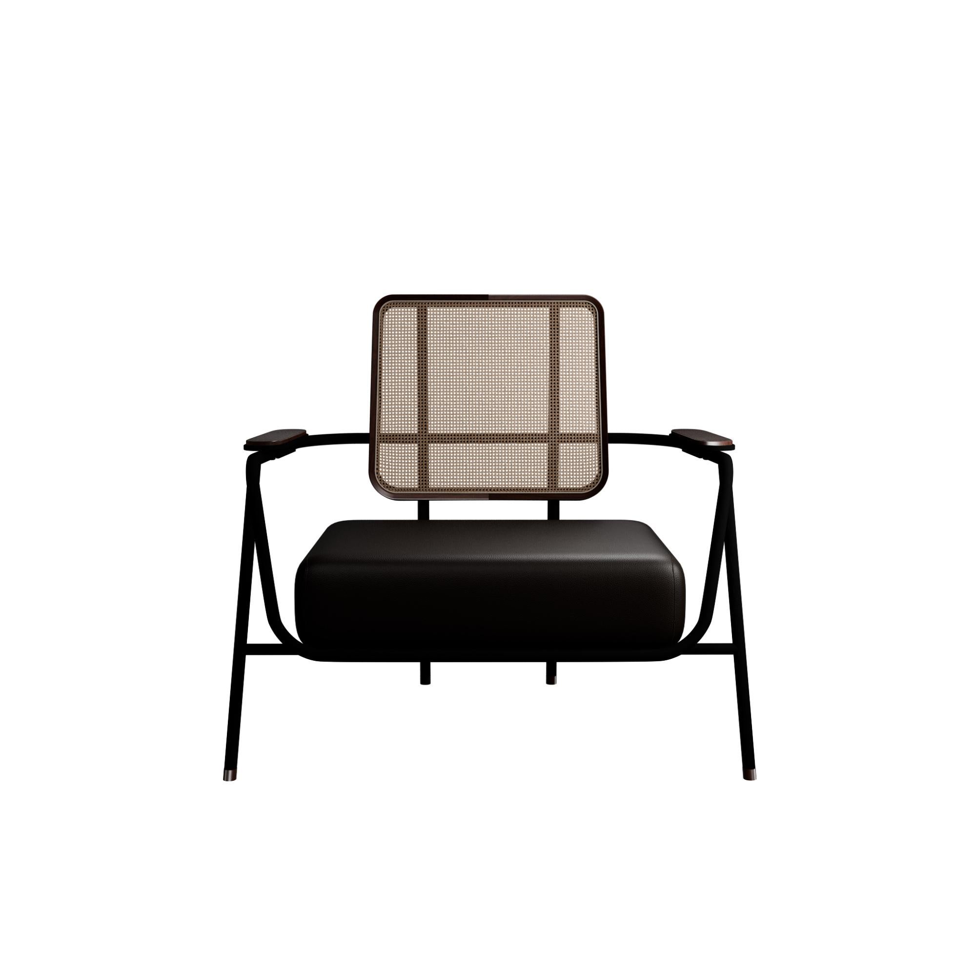 Murmurio's armchair with arm DUV sturdy iron structure provides a solid foundation, while the intricately woven rattan backrest, supported by an ashwood frame, adds a touch of natural beauty. The seat is upholstered in genuine leather, offering both