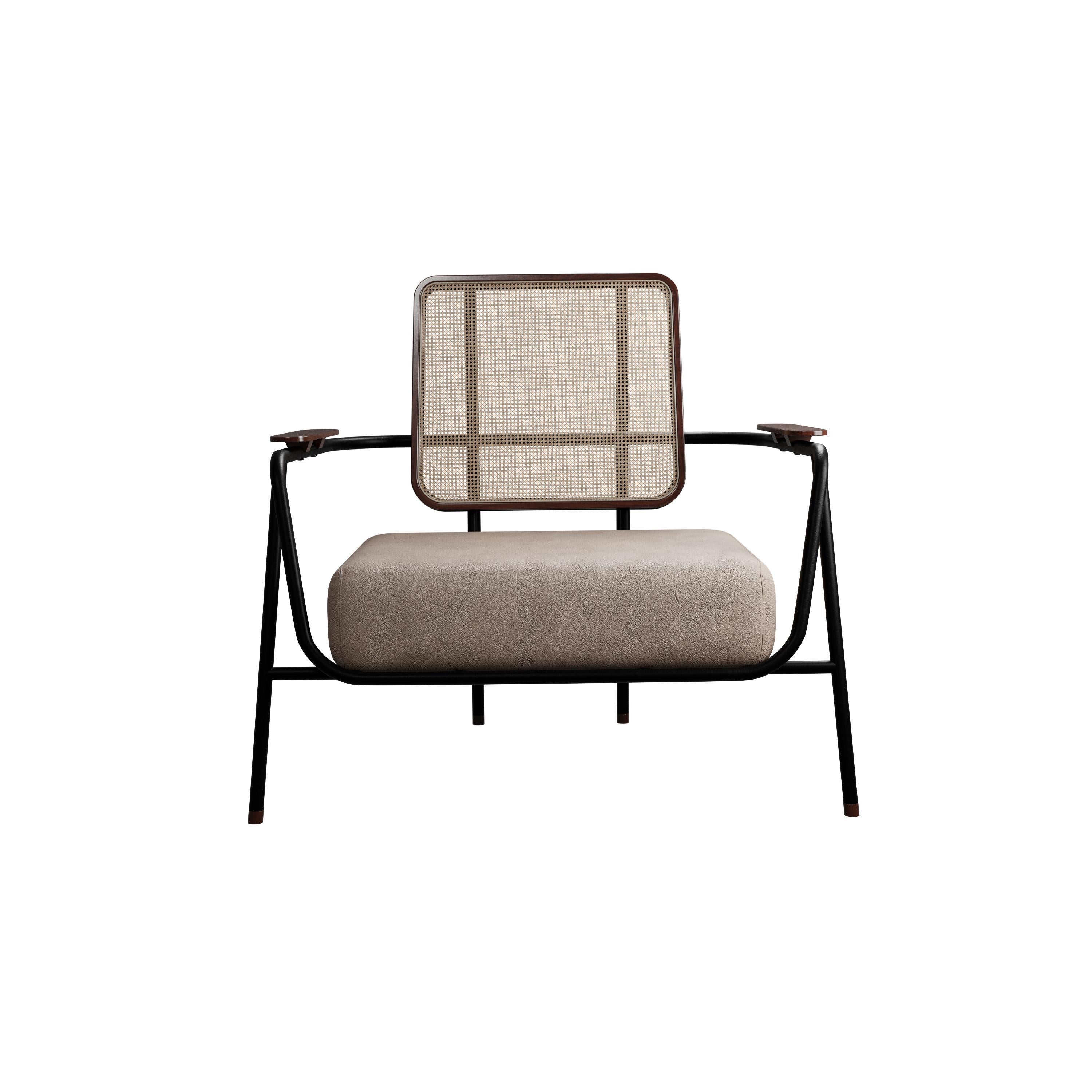 Murmurio's armchair with arm DUV sturdy iron structure provides a solid foundation, while the intricately woven rattan backrest, supported by an ashwood frame, adds a touch of natural beauty. The seat is upholstered in genuine leather, offering both