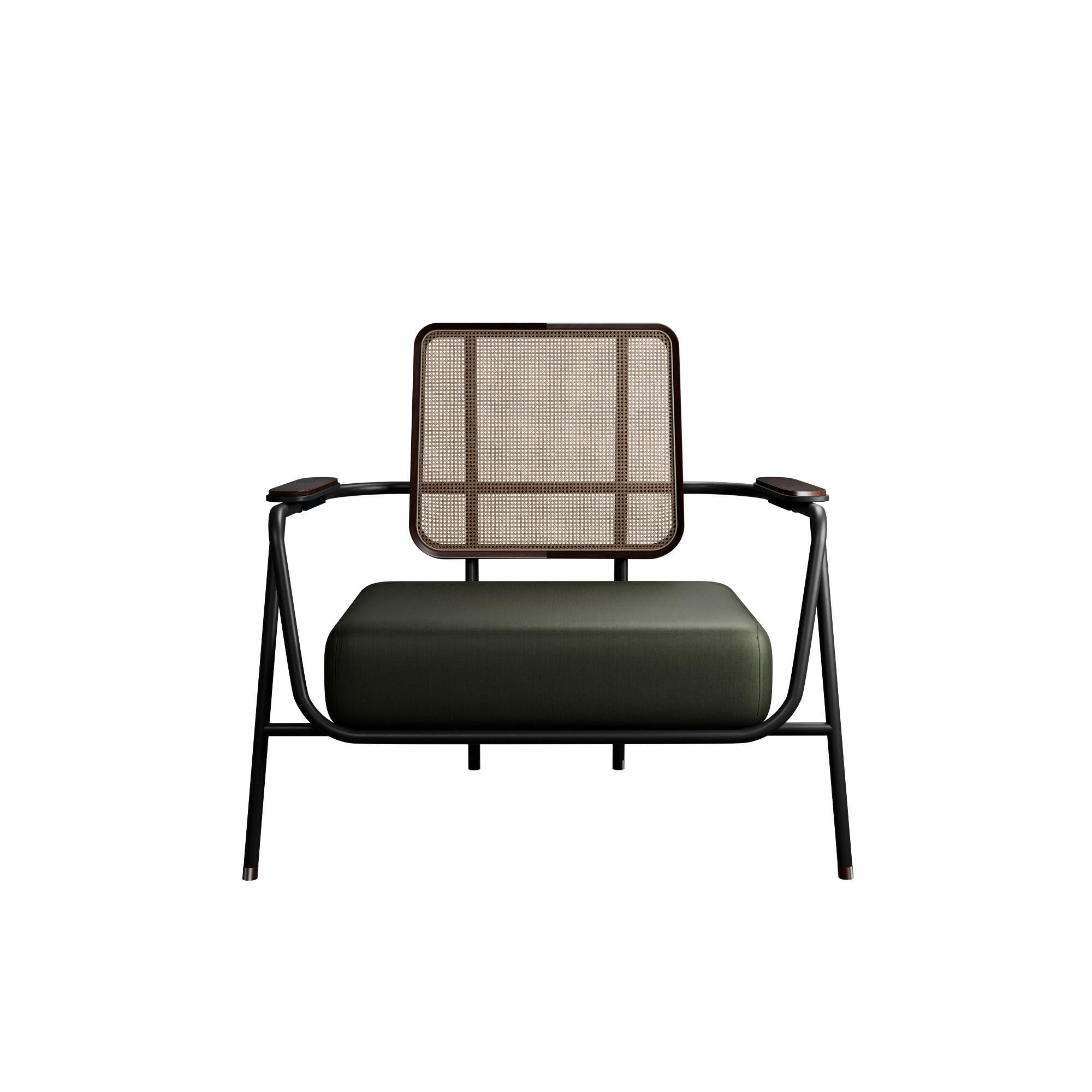 Murmurio's armchair with arm DUV sturdy iron structure provides a solid foundation, while the intricately woven rattan backrest, supported by an ashwood frame, adds a touch of natural beauty. The seat is upholstered in genuine leather, offering both