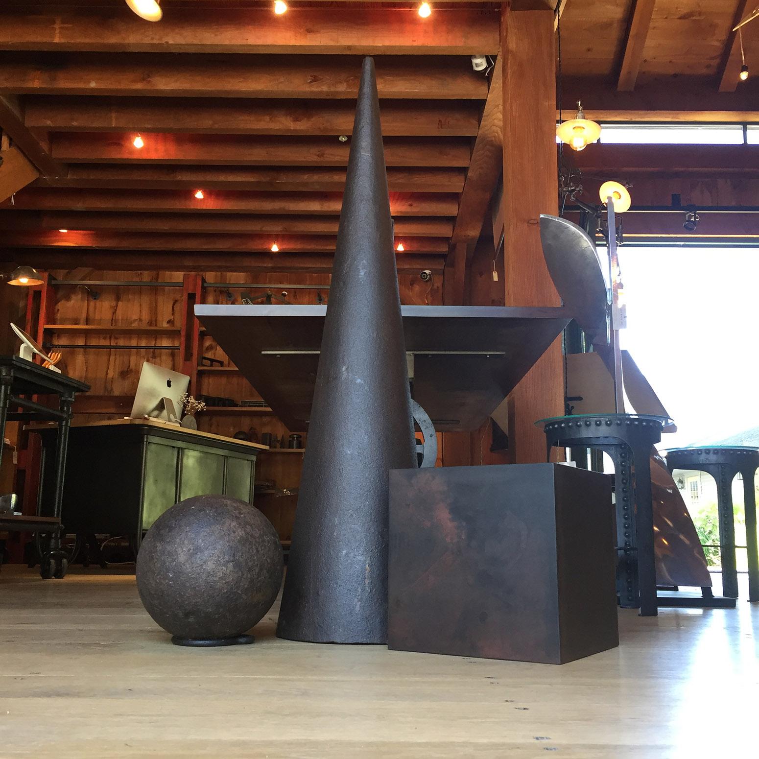 Industrial iconic art installation geometric shapes. Cone is an antique solid ductile cast iron blacksmith's mandrel - 48 1/4