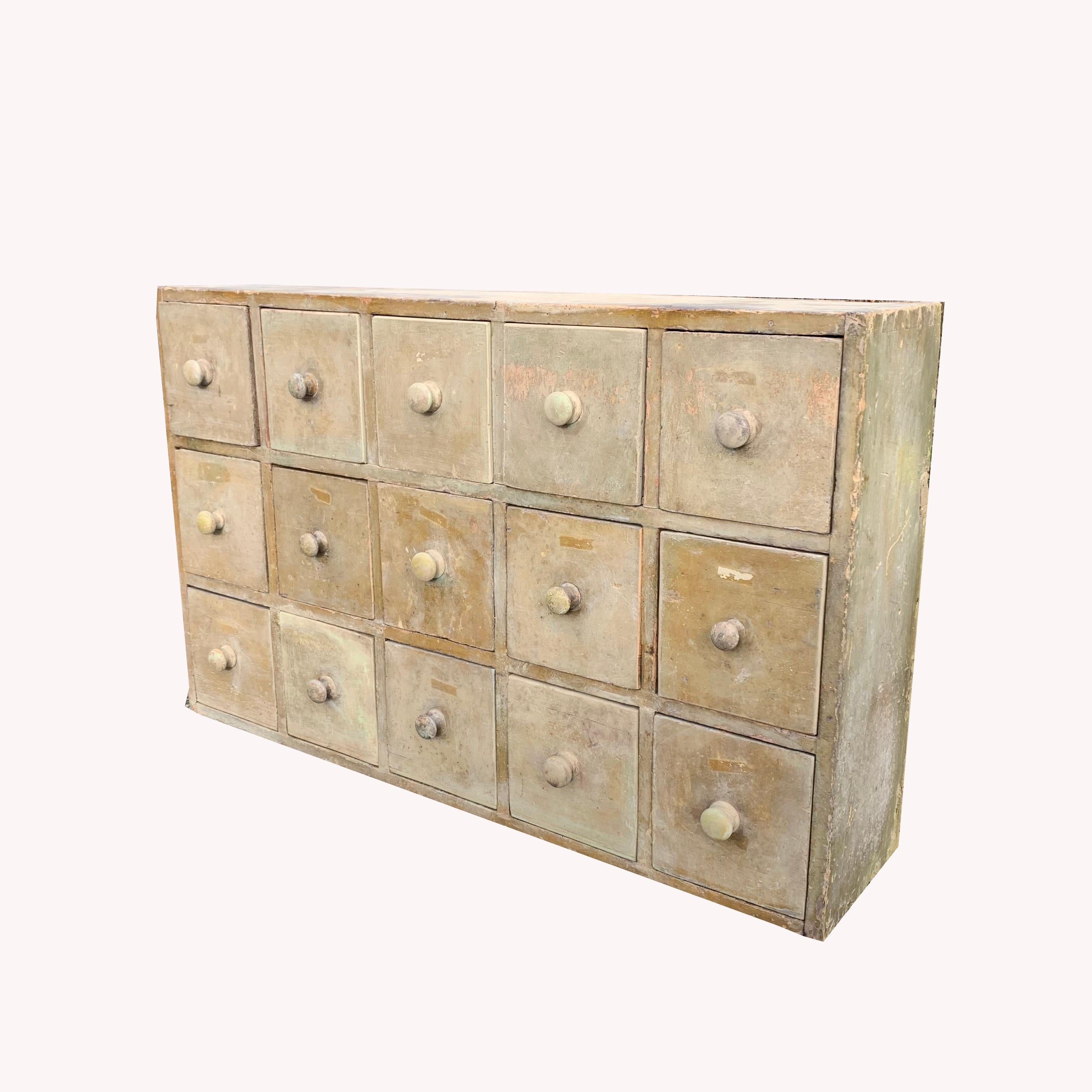 A fabulous early 20th century table-top painted pine bank of 15 drawers from a workshop.
Retaining the original soft-tone 'duck-egg blue'/greenie-grey paint which is beautifully aged and faded,
A great example that would add immense character to a
