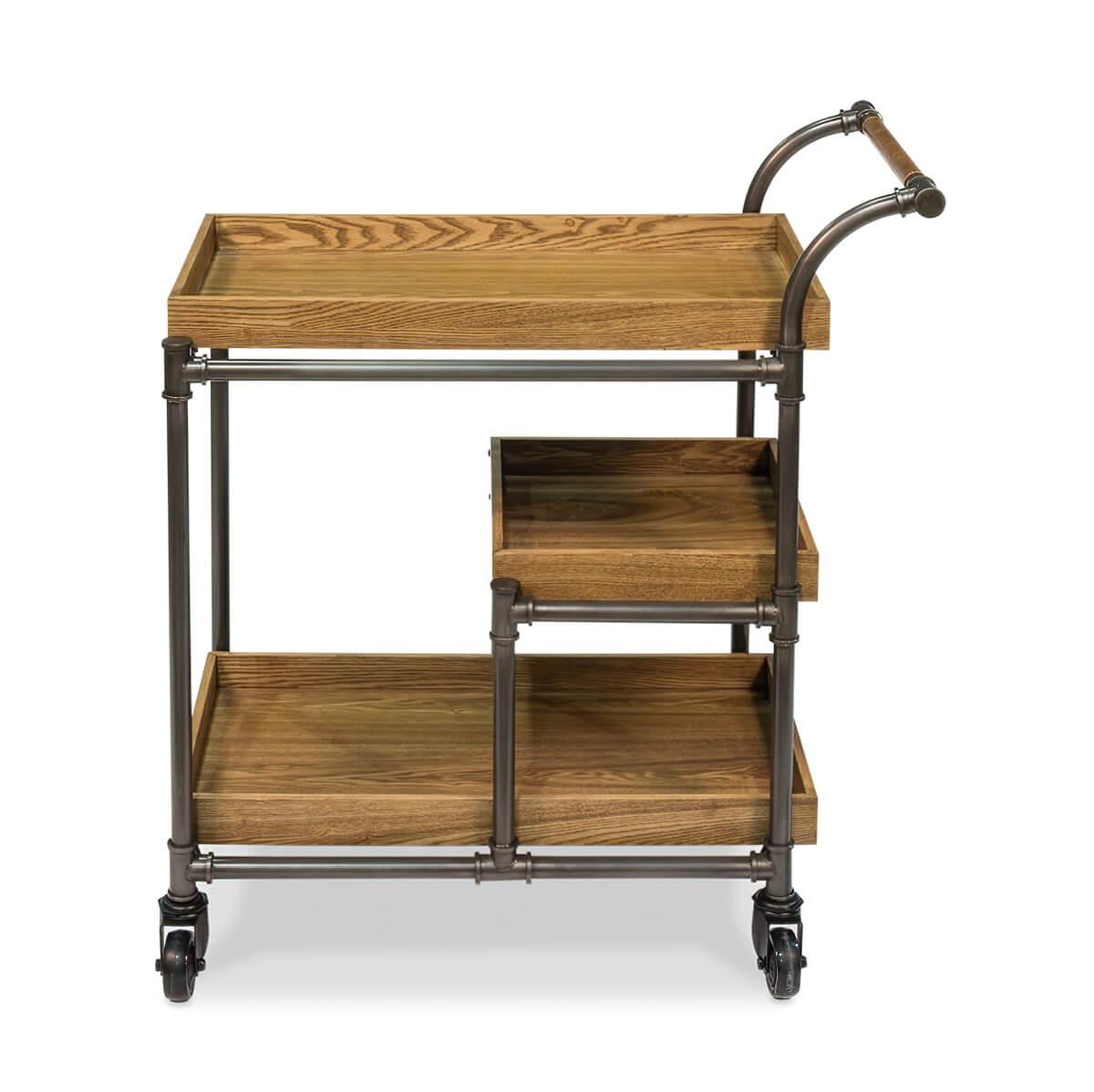 A modern Industrial style bar cart trolley with weathered oak wooden tray shelves and a pipe frame raised on large casters.

Dimensions: 20