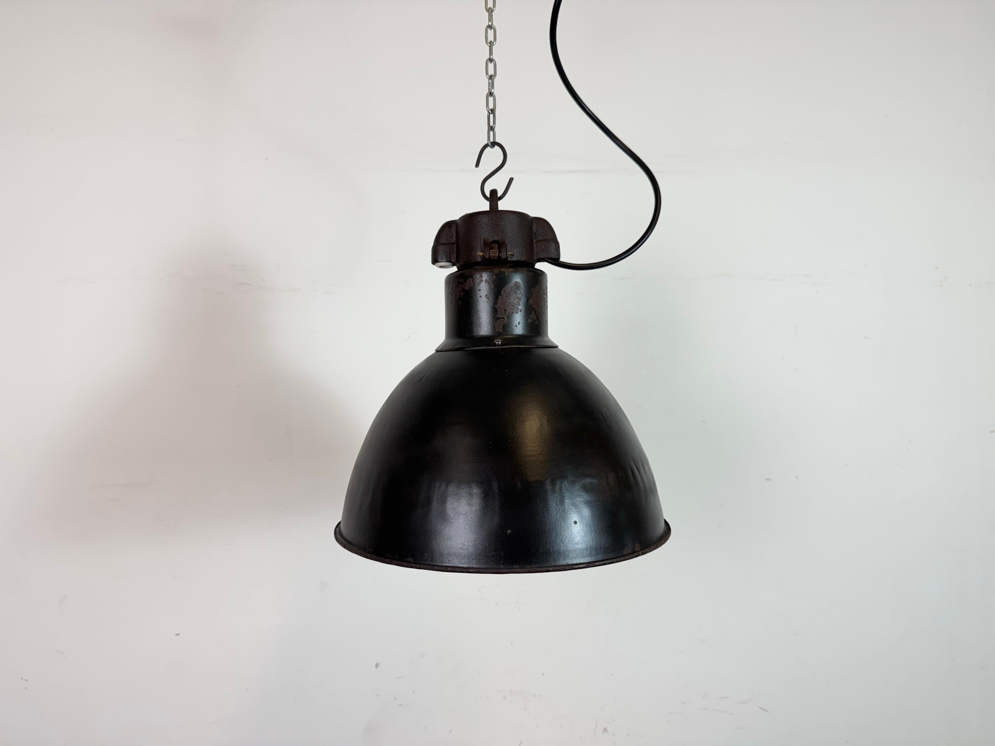 - Vintage Industrial rusty black enamel pendant lamp
- Designed in the period of Bauhaus, 
1930s 
- Produced from 1930s till 1970s
- White enamel inside the shade 
- Cast iron top 
- New porcelain socket requires standard E27/E26 lightbulbs 
- New