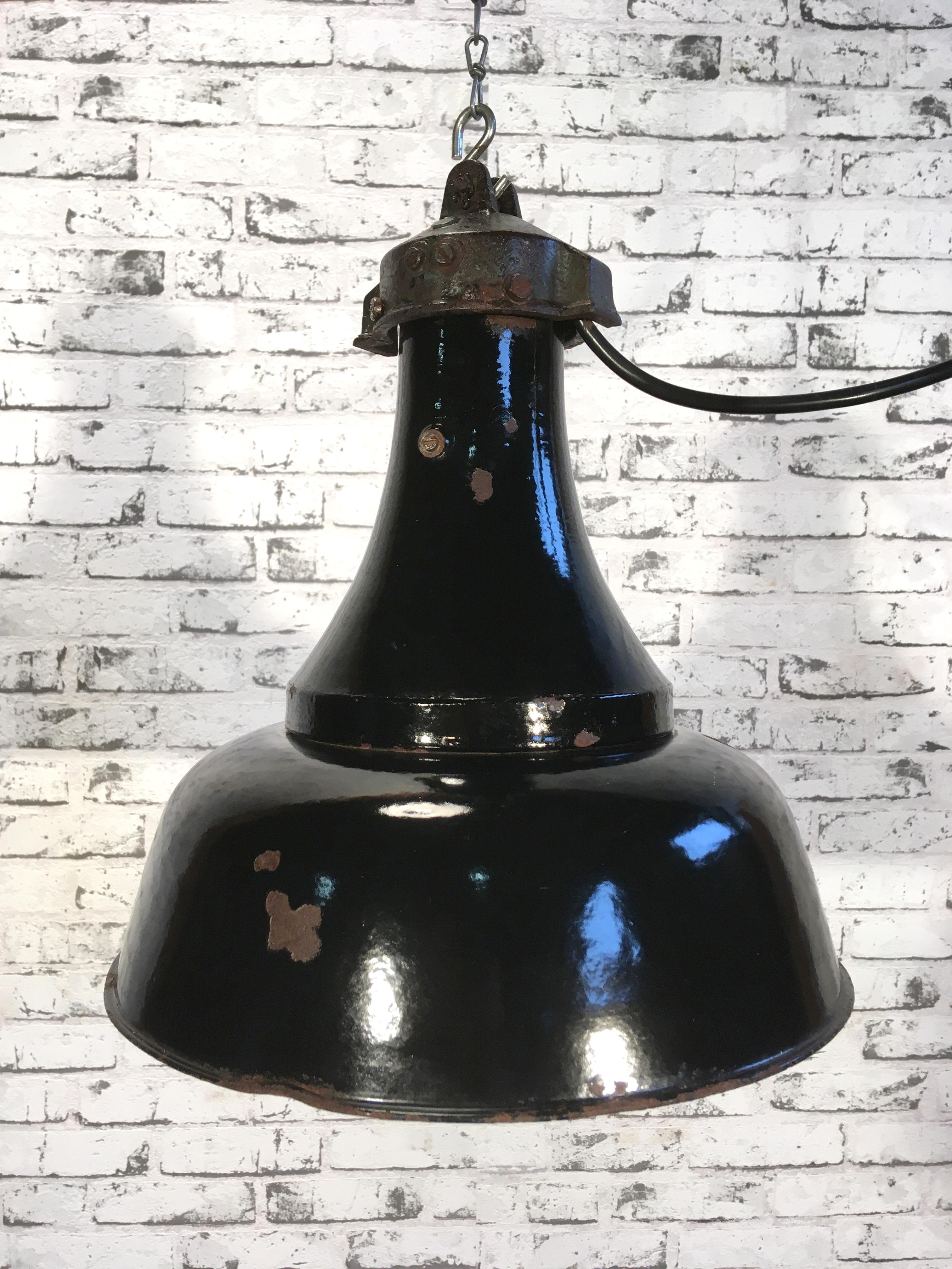 Very old industrial pendant lamp. Used in factories in former Czechoslovakia, 1920s, black enamel. Cast Iron top. New wiring and new porcelain E 27 socket. Weight: 2 kg.
