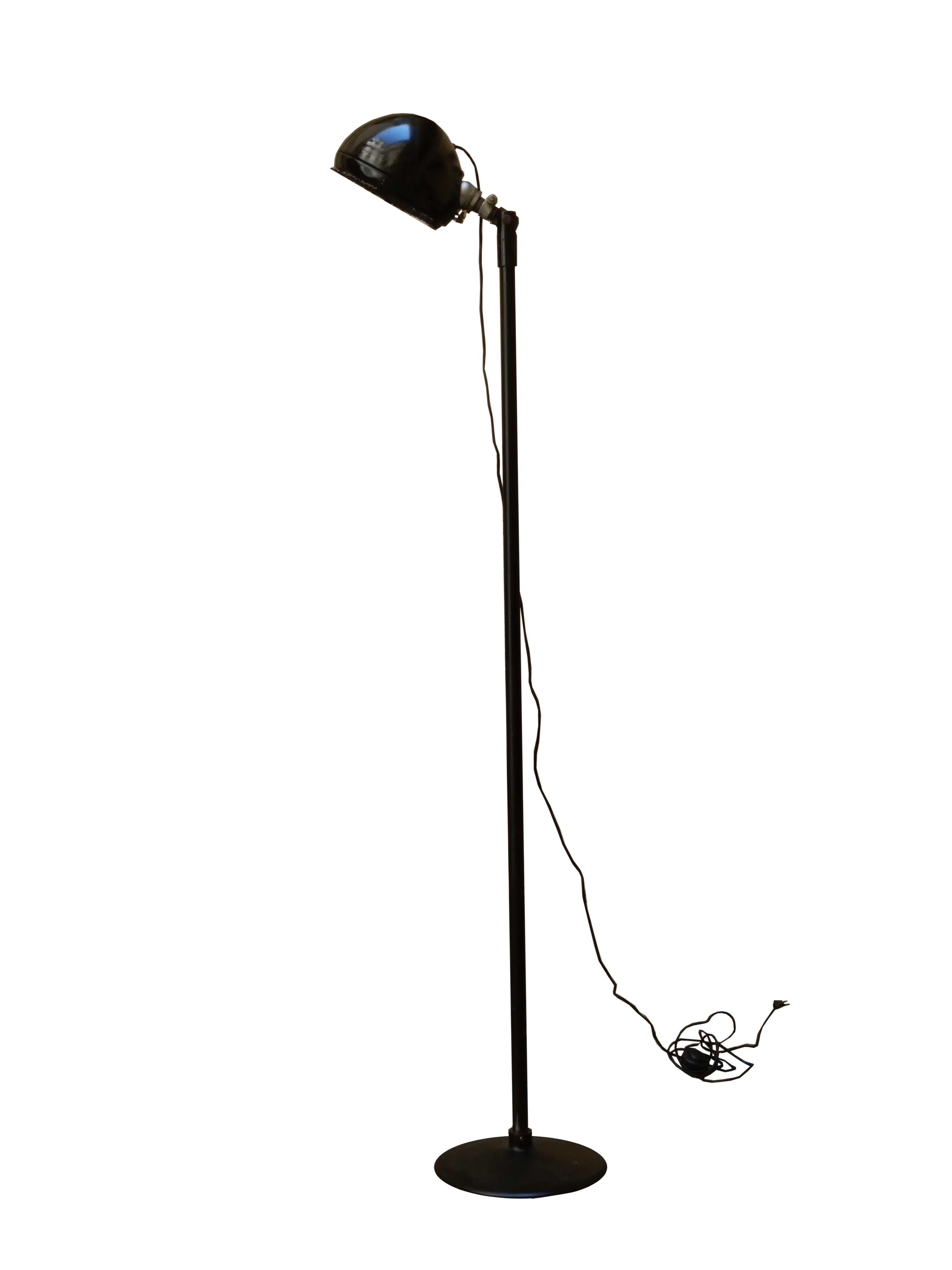 Industrial-style floor lamp made entirely of black-stained metal and 1980s grilled parabola lampshade.