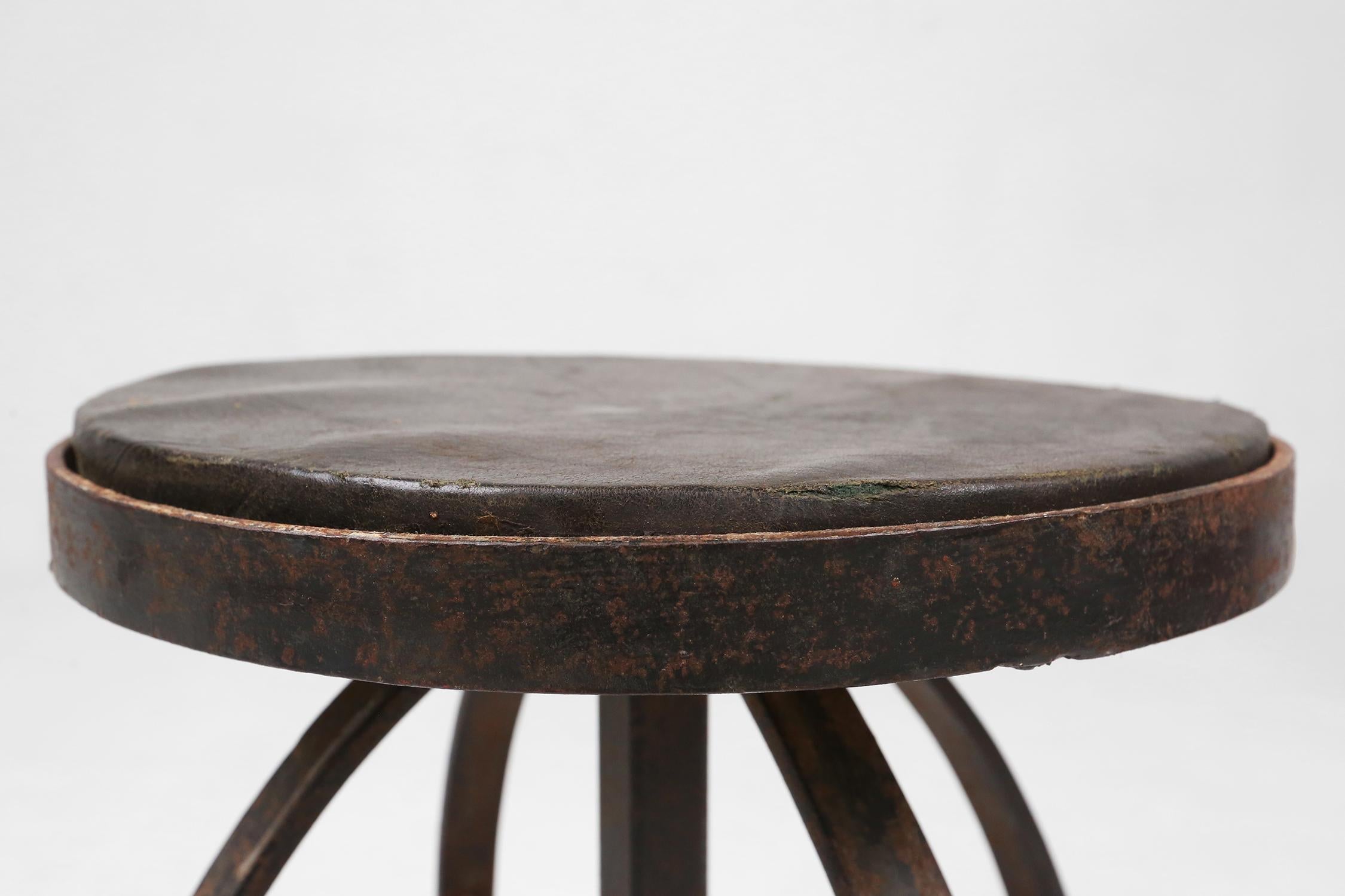 French Industrial black metal stool with unique frame, France ca. 1920 For Sale