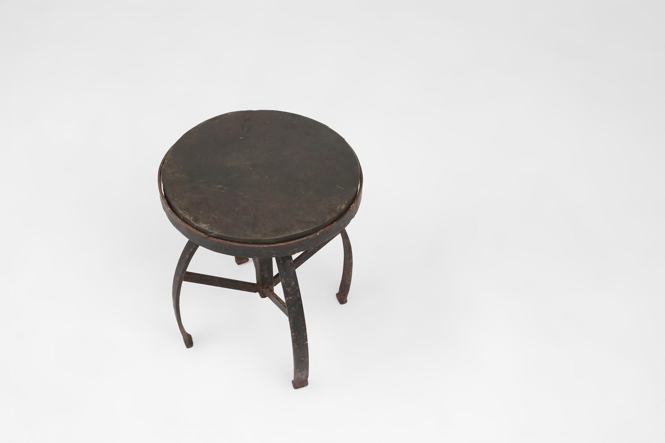 Early 20th Century Industrial black metal stool with unique frame, France ca. 1920 For Sale